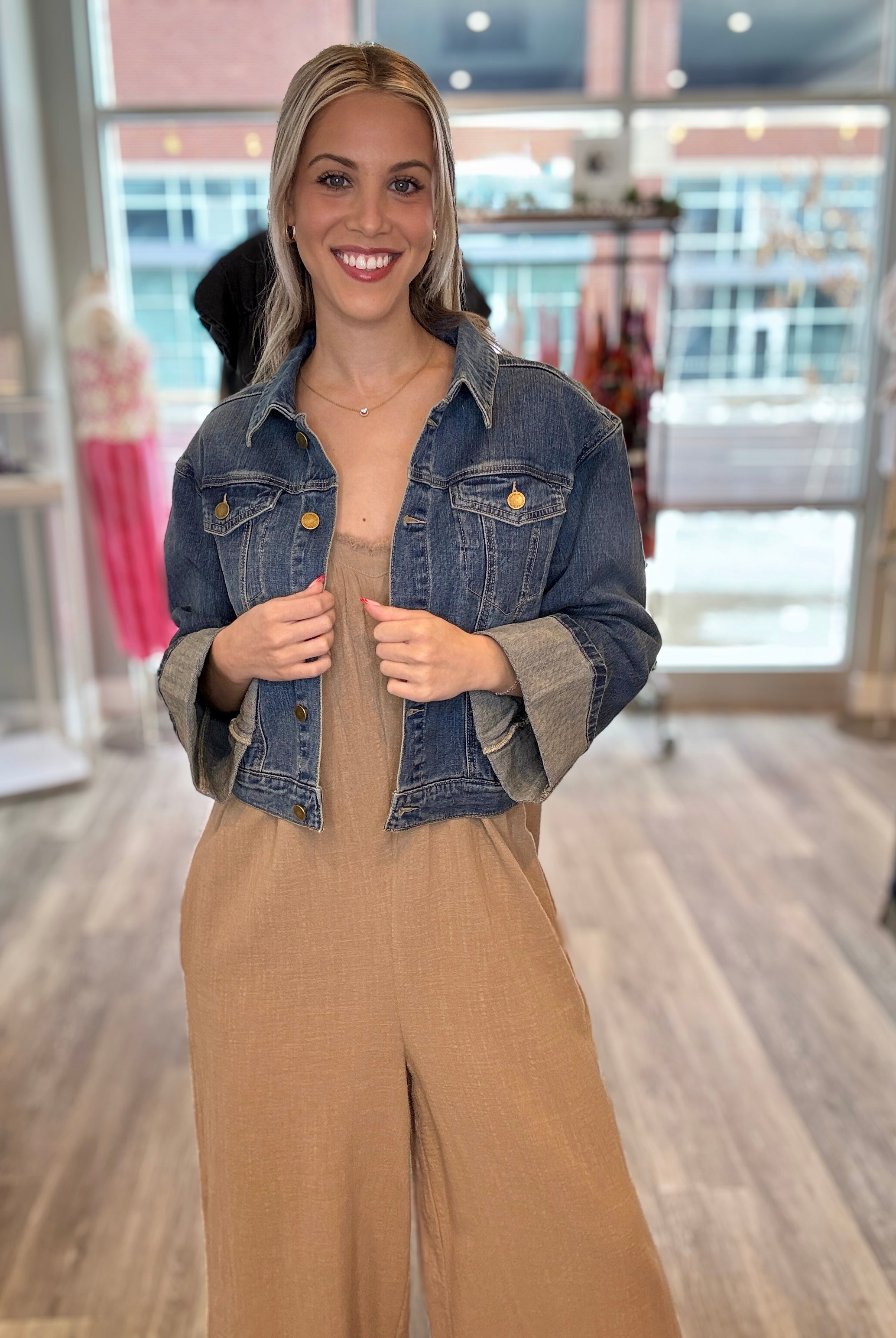 woman weaing Mac and Me Crop Fixed cuff jean jacket with linen overalls