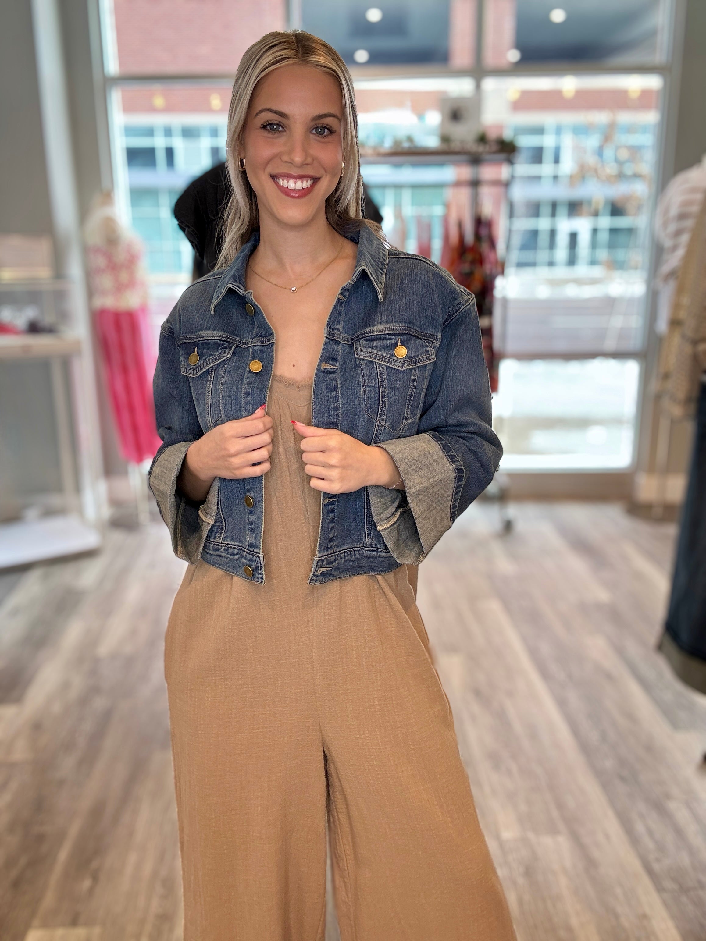 woman weaing Mac and Me Crop Fixed cuff jean jacket with linen overalls