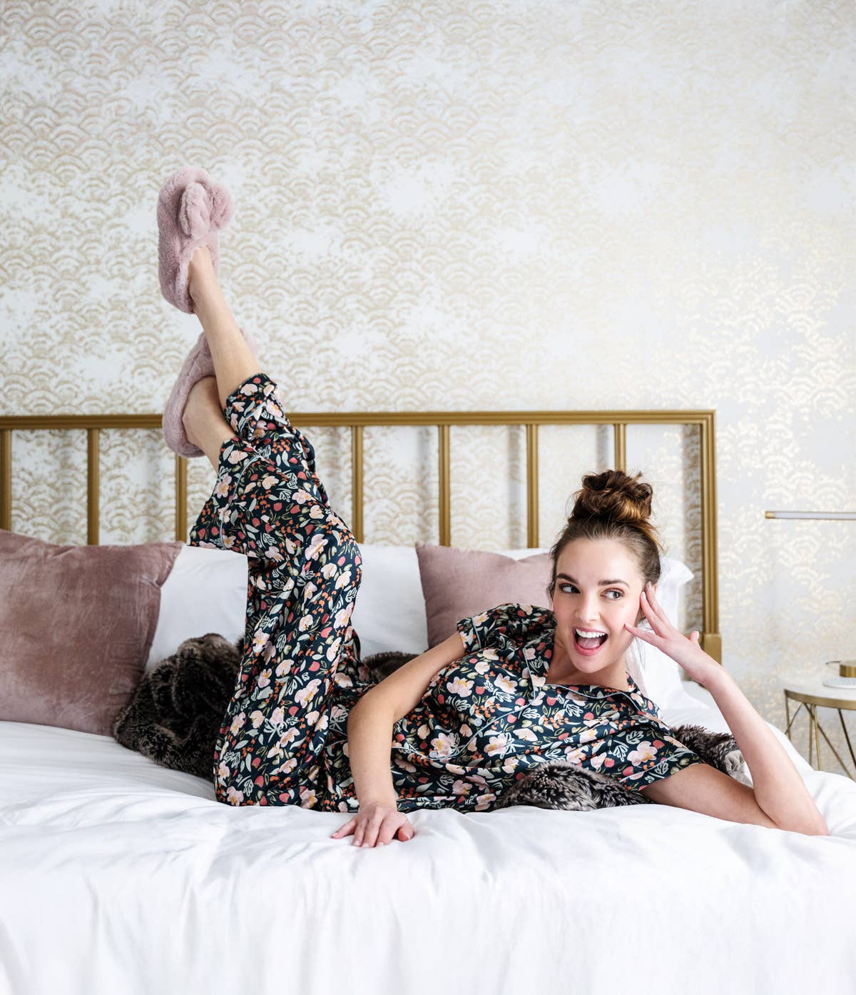 woman wearing the microwavable plush heated slippers with weighted spa bead upper