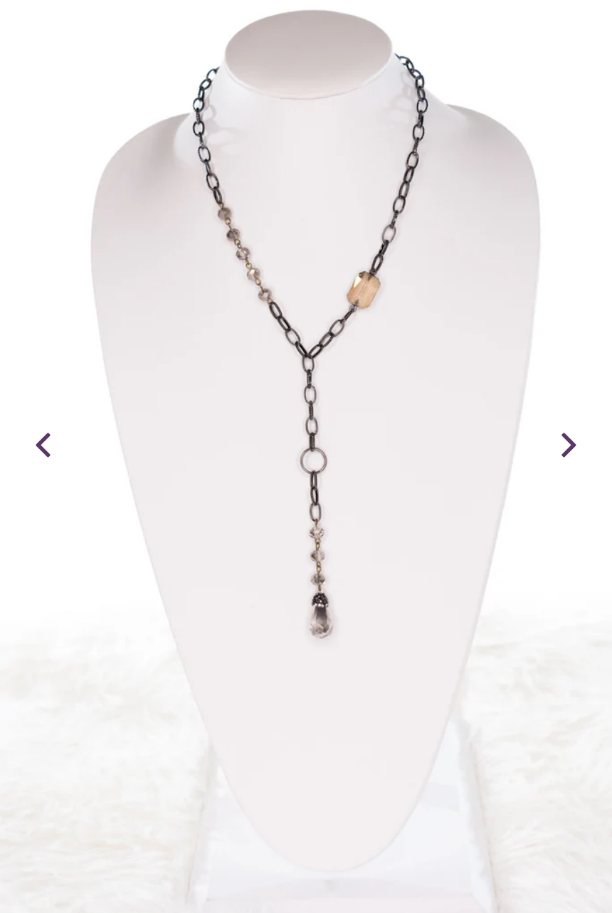 gunmetal lariat necklace adorned with crystals, beads and a crystal pendant.