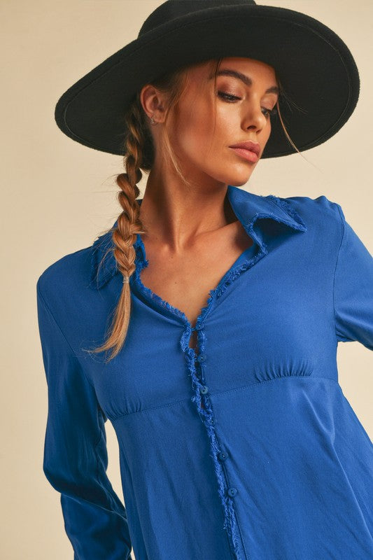 woman wearing a blue peplum top