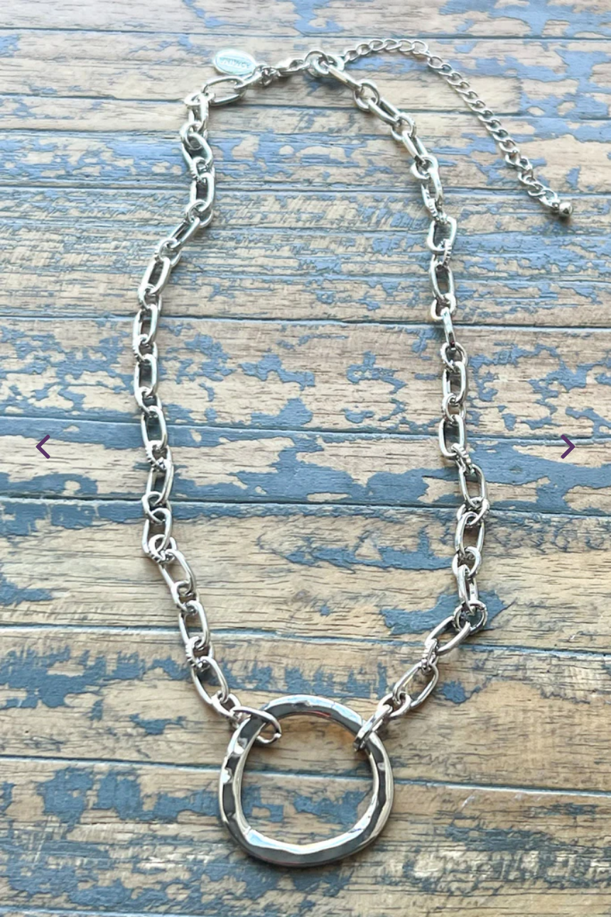 Gretchen necklace is a silver necklace with a silver ring pendant.