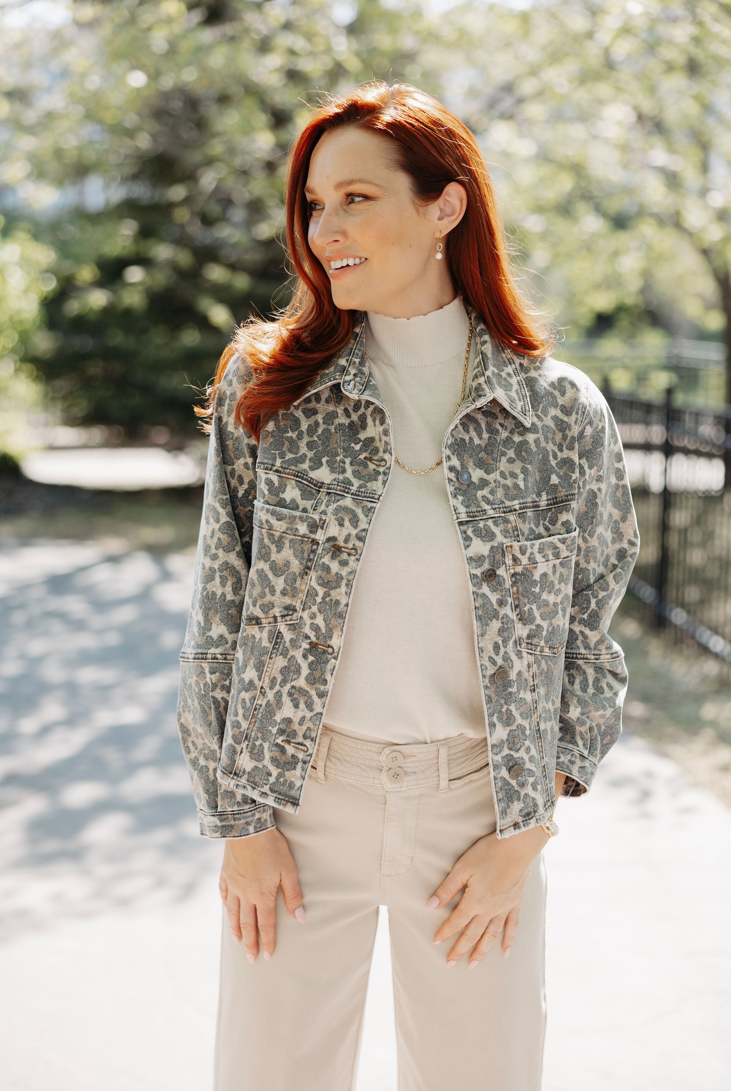 Woman wearing animal print jacket from Mainstream Boutique Bloomington.
