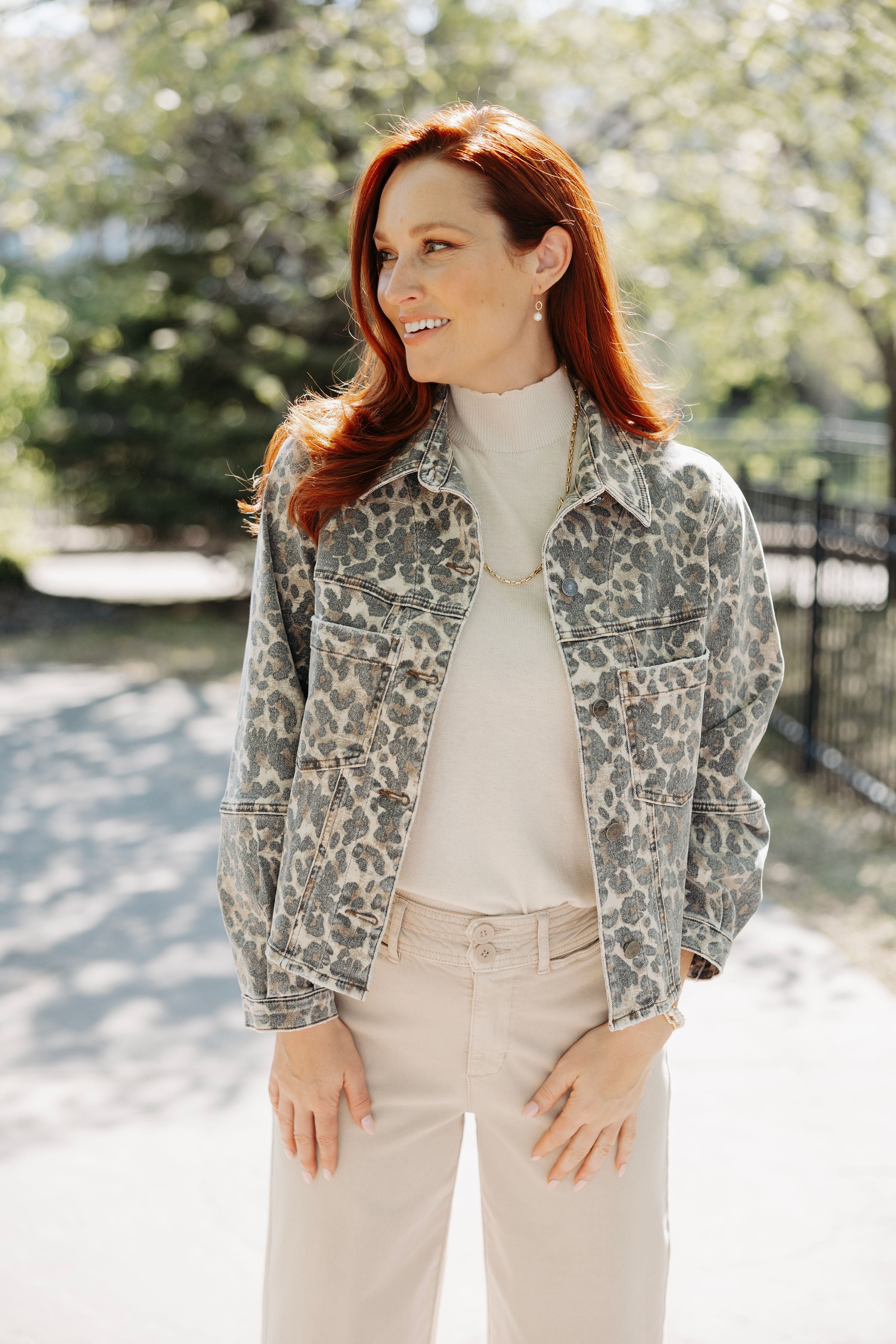 Woman wearing animal print jacket from Mainstream Boutique Bloomington.