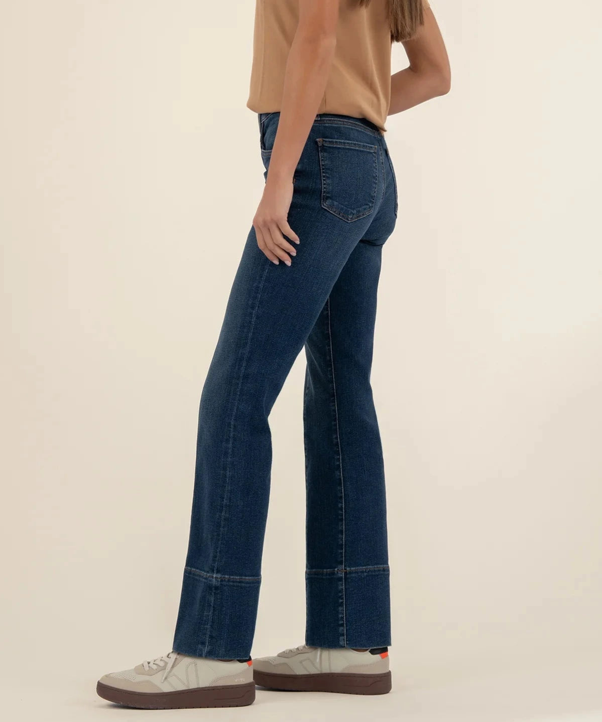 person showing the side of the kelsey high rise fab ab wide ankle denim in the color envision
