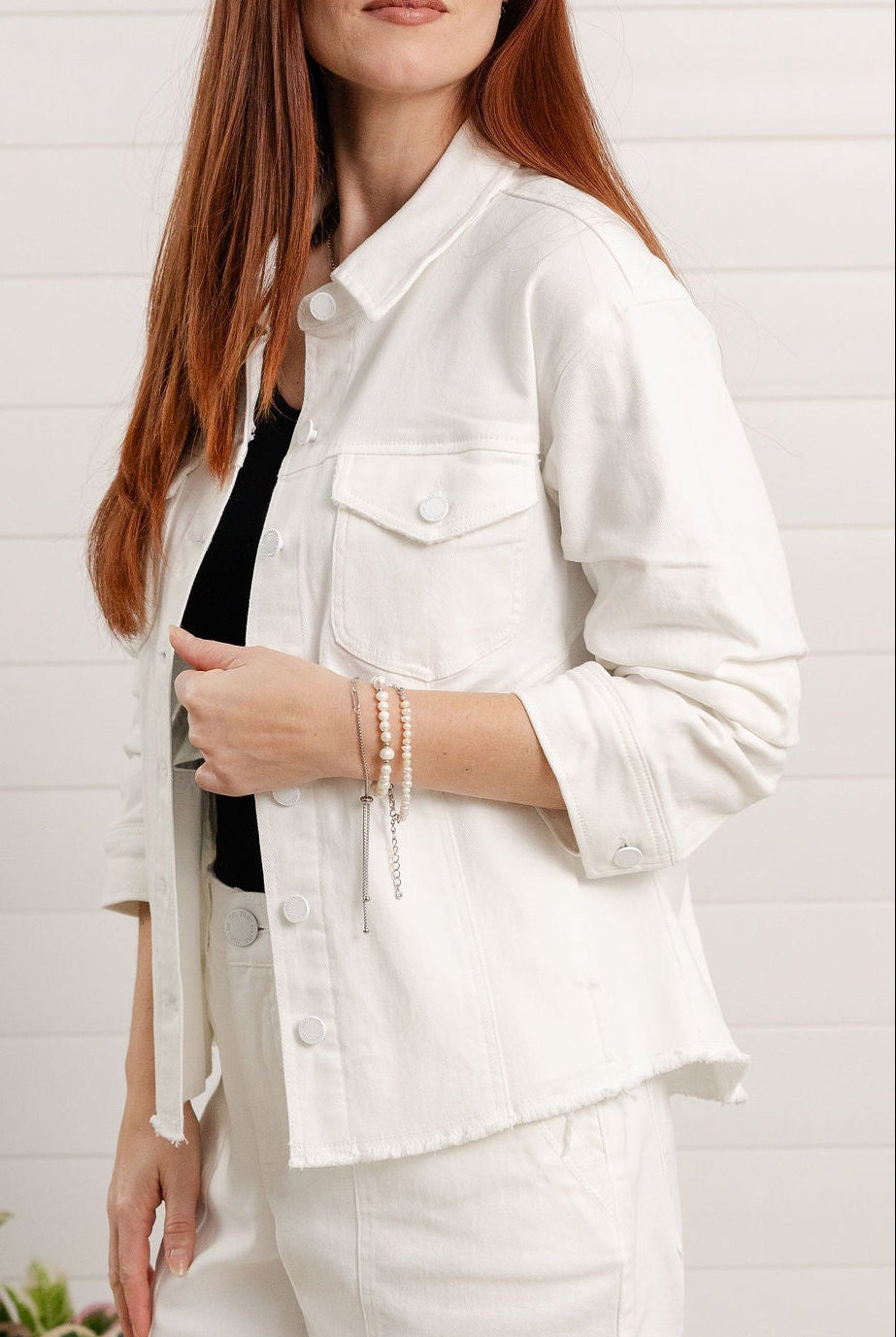 Close-up of ruched sleeve detail on Mac and Me white denim jacket