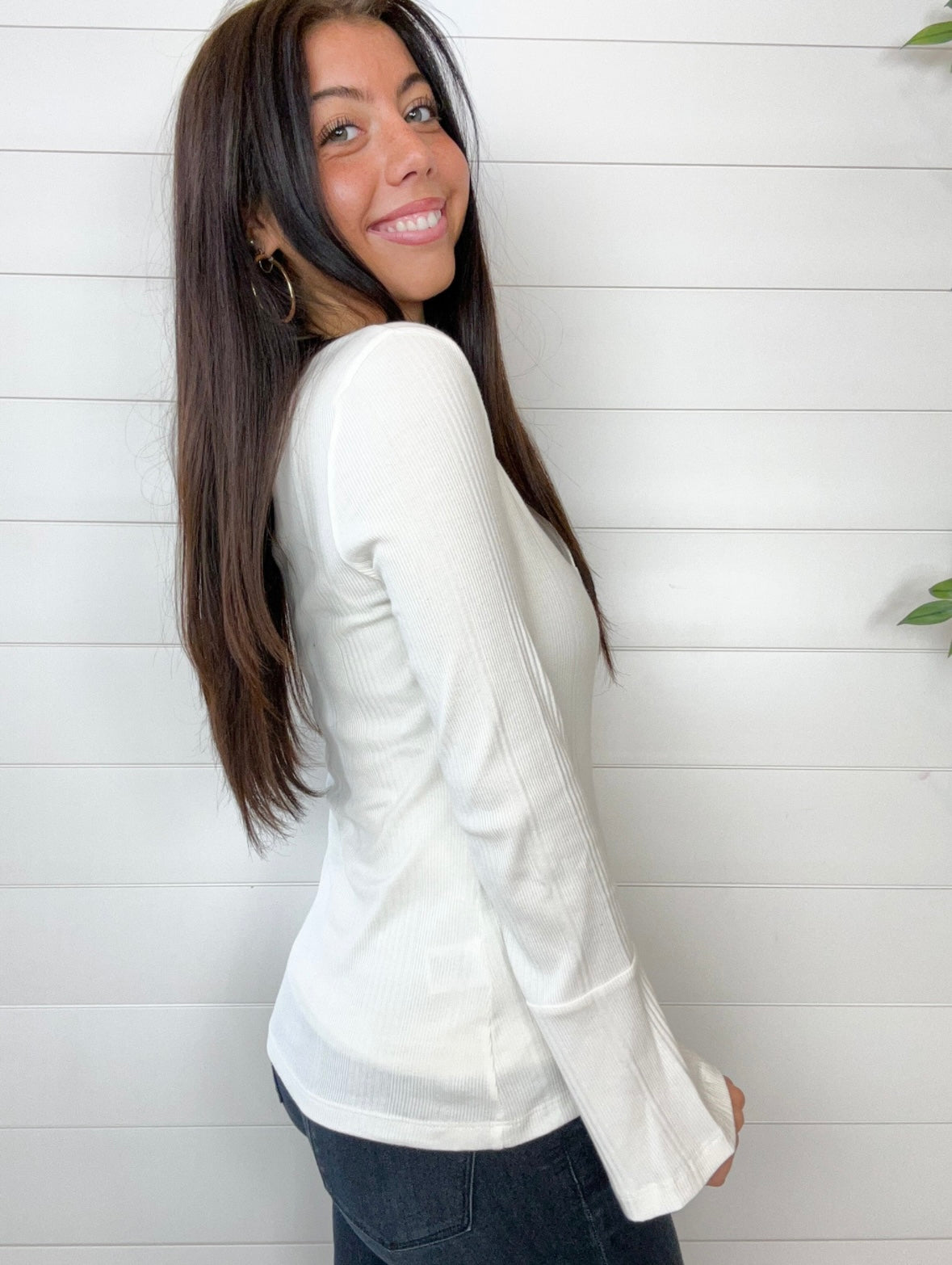 Side of the bell sleeve ribbed top in white