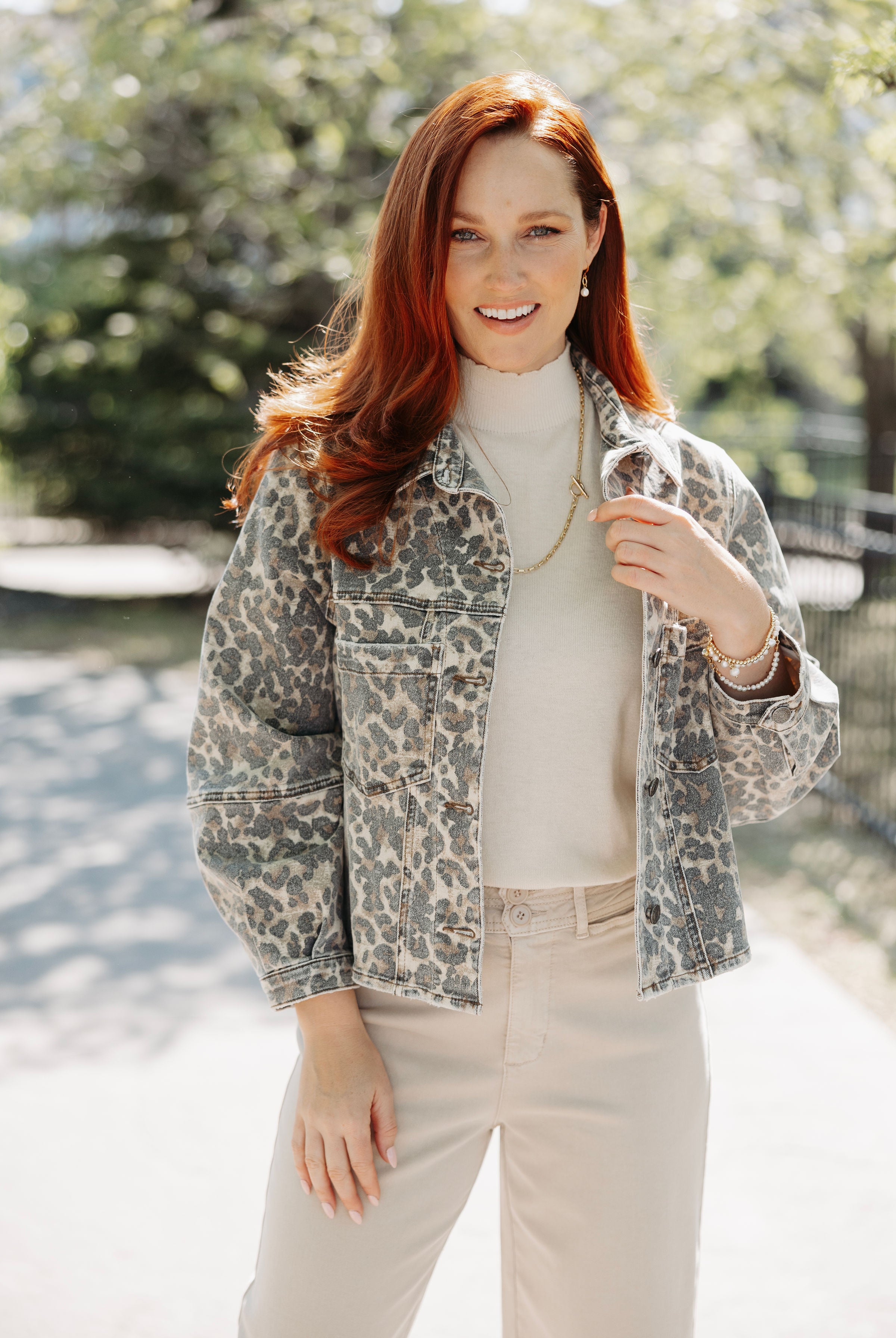 Woman modeling the Bailey Button Front Jacket in an animal print.