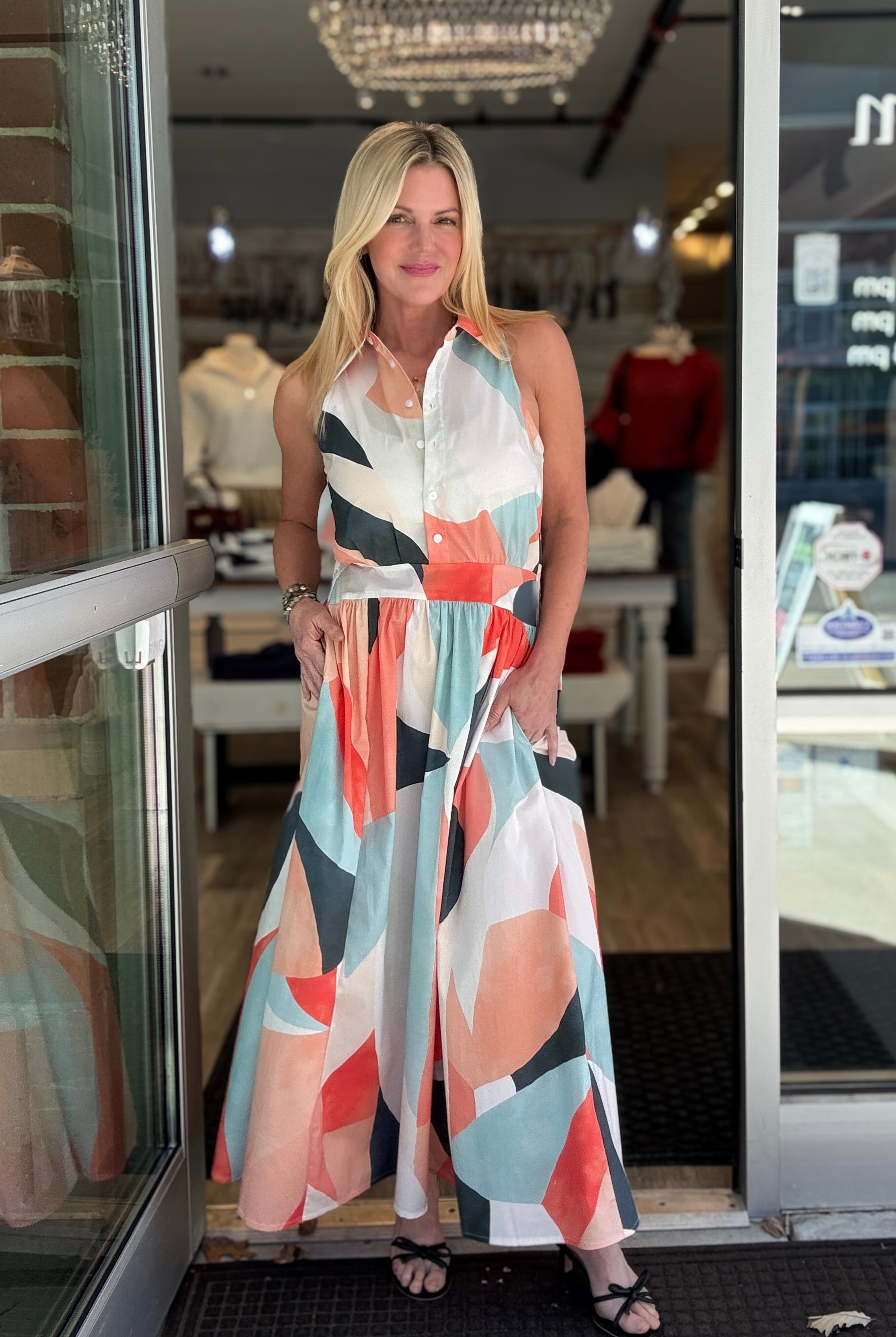 Woman wearing a colorful prism print midi dress