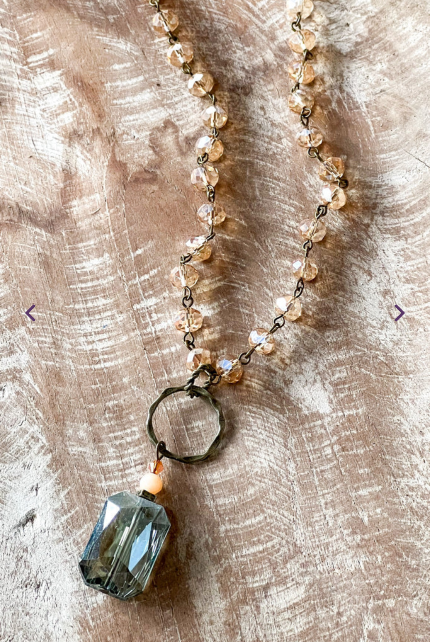 crystal necklace with a gunmetal ring and a crystal pendant.