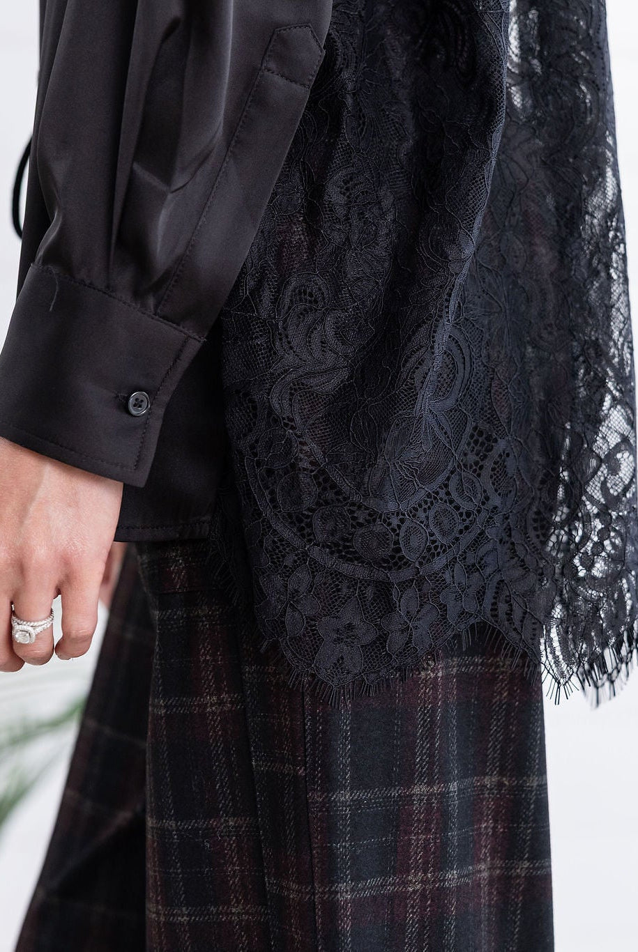 detailed view of black lace-back-button down-lace