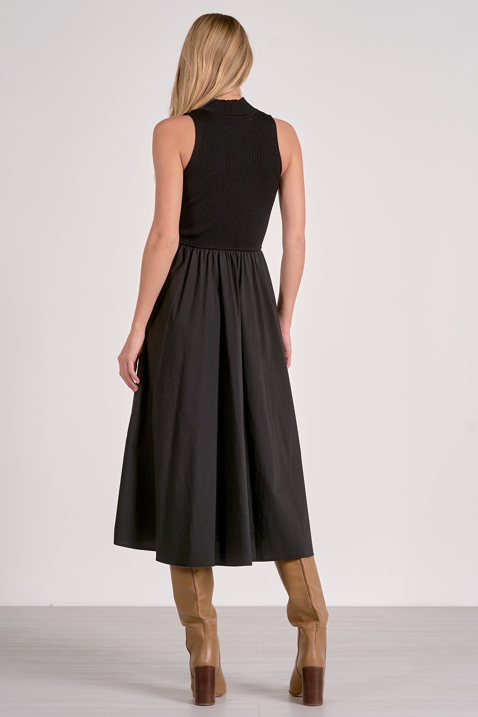 Back view of black cotton blend maxi dress with mock neck and sleeveless design, easy to layer or wear solo