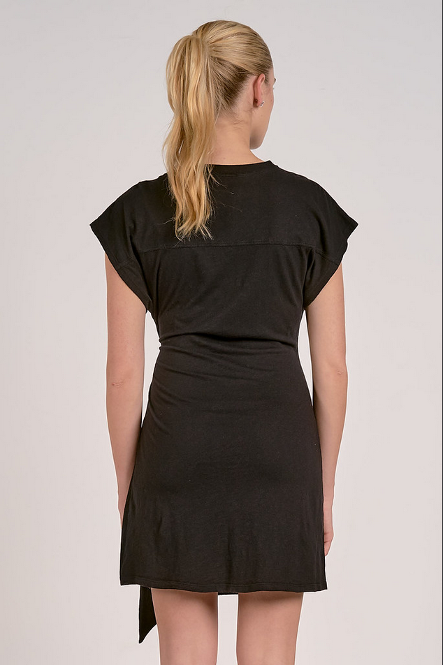 back of simple black dress with flattering waist tie and relaxed fit