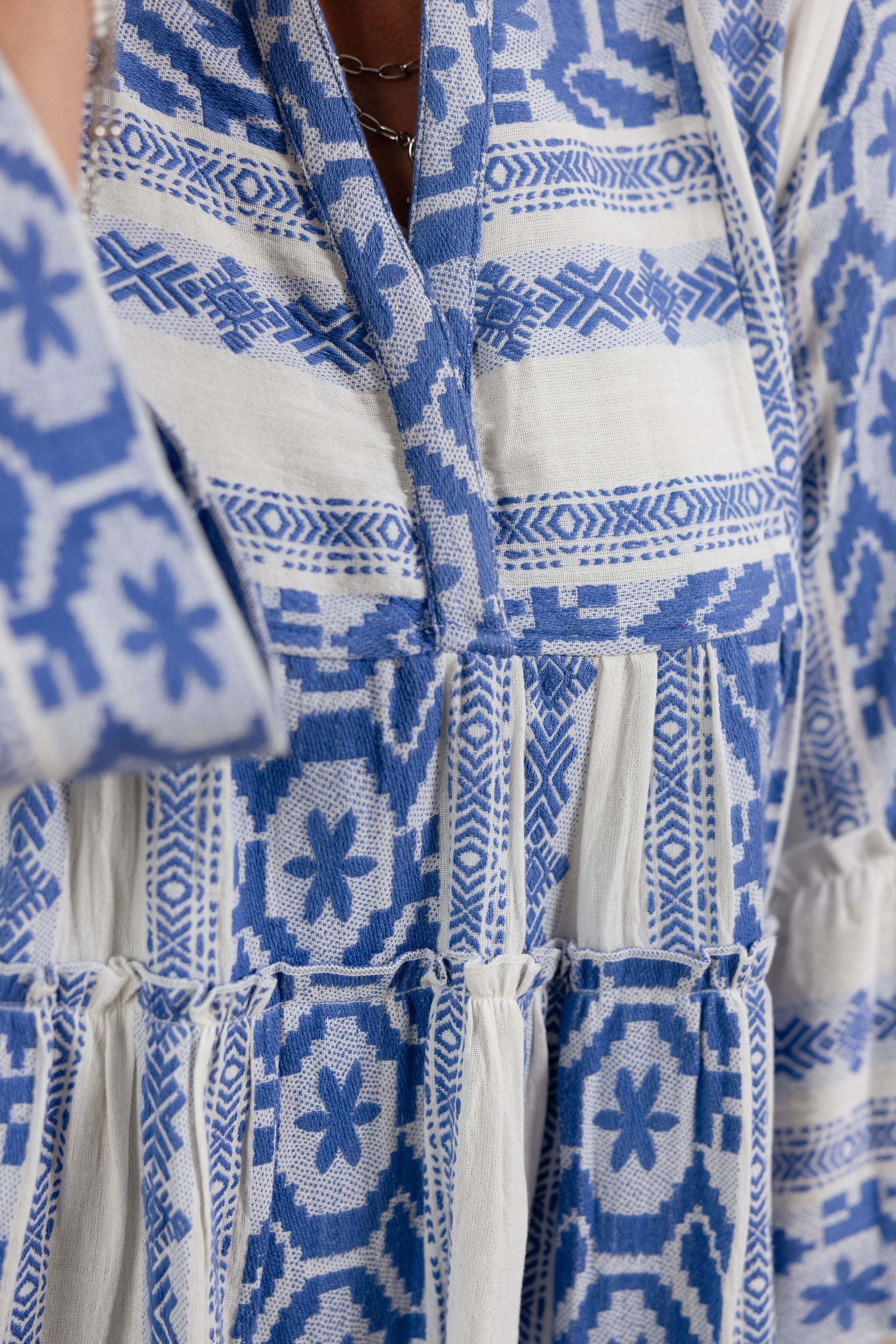 Close-up of a blue and white print dress