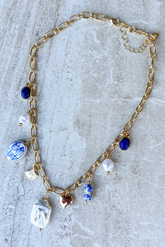 Gold chain necklace with blue white porcelain bead charms
