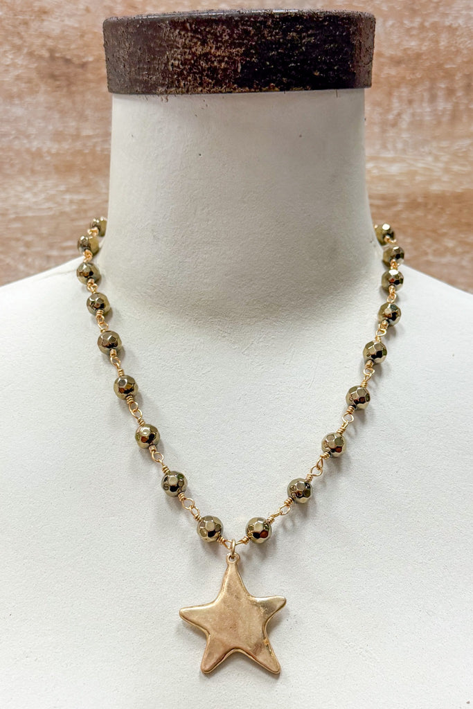 gold and bead necklace with solid star pendant