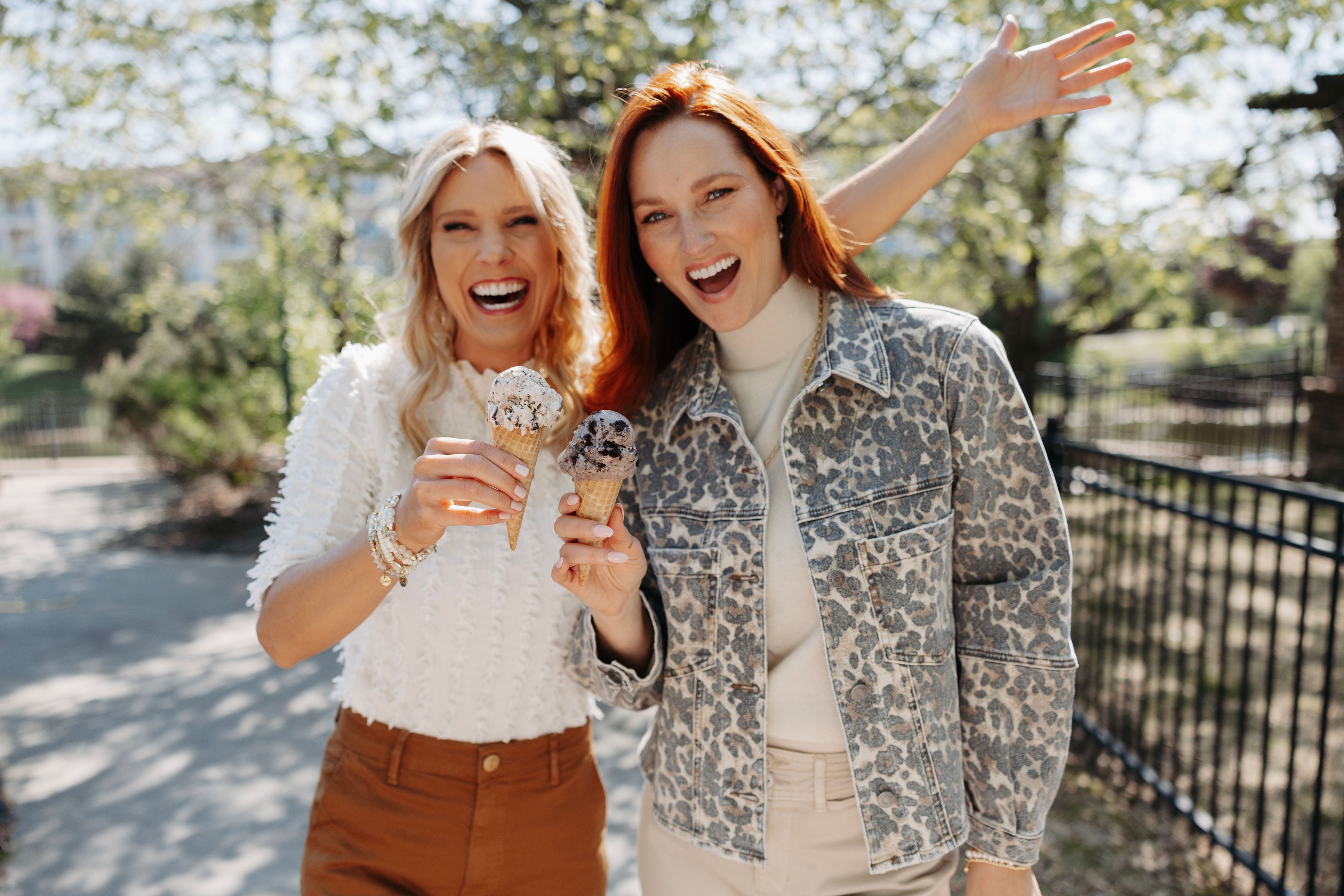 two women enjoying a walk with ice cream in their new outfits from Mainstream Boutique Bloomington