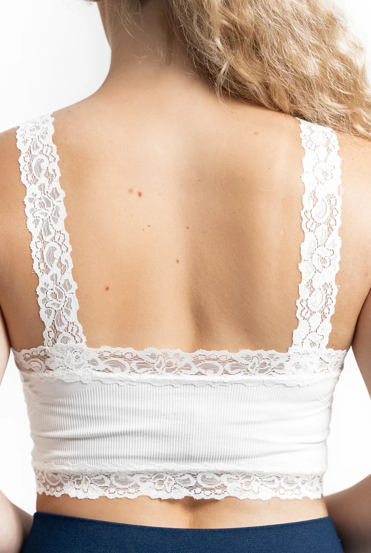 Showing the details from the back of the ivory bralette