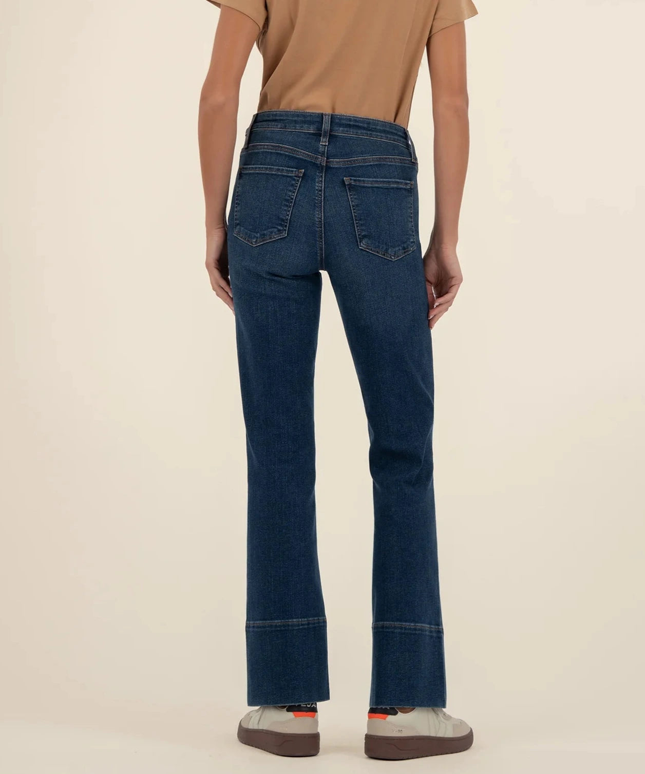 person showing the back of the kelsey hi-rise fab ab denim in the color envision or dark wash.