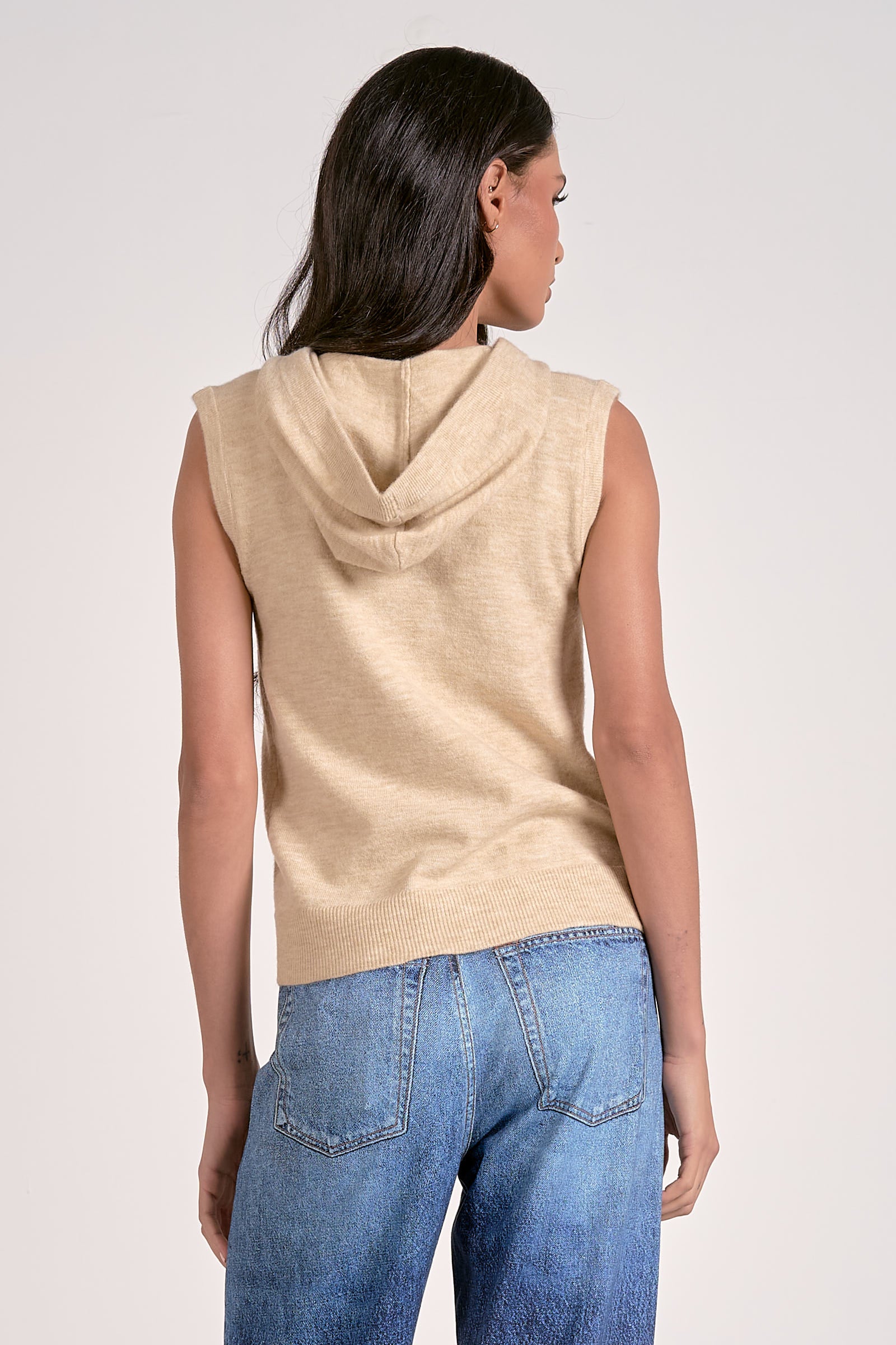 Oatmeal knitted sleeveless hoodie with zip front, lightweight layering piece from Mainstream Boutique Bloomington
