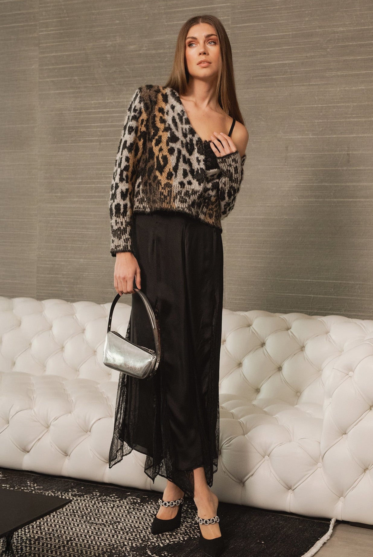 Model wearing Meet & Greet Eyelash Leopard Cardigan in fuzzy eyelash knit with leopard print and button-front closure from Mainstream Boutique Bloomington