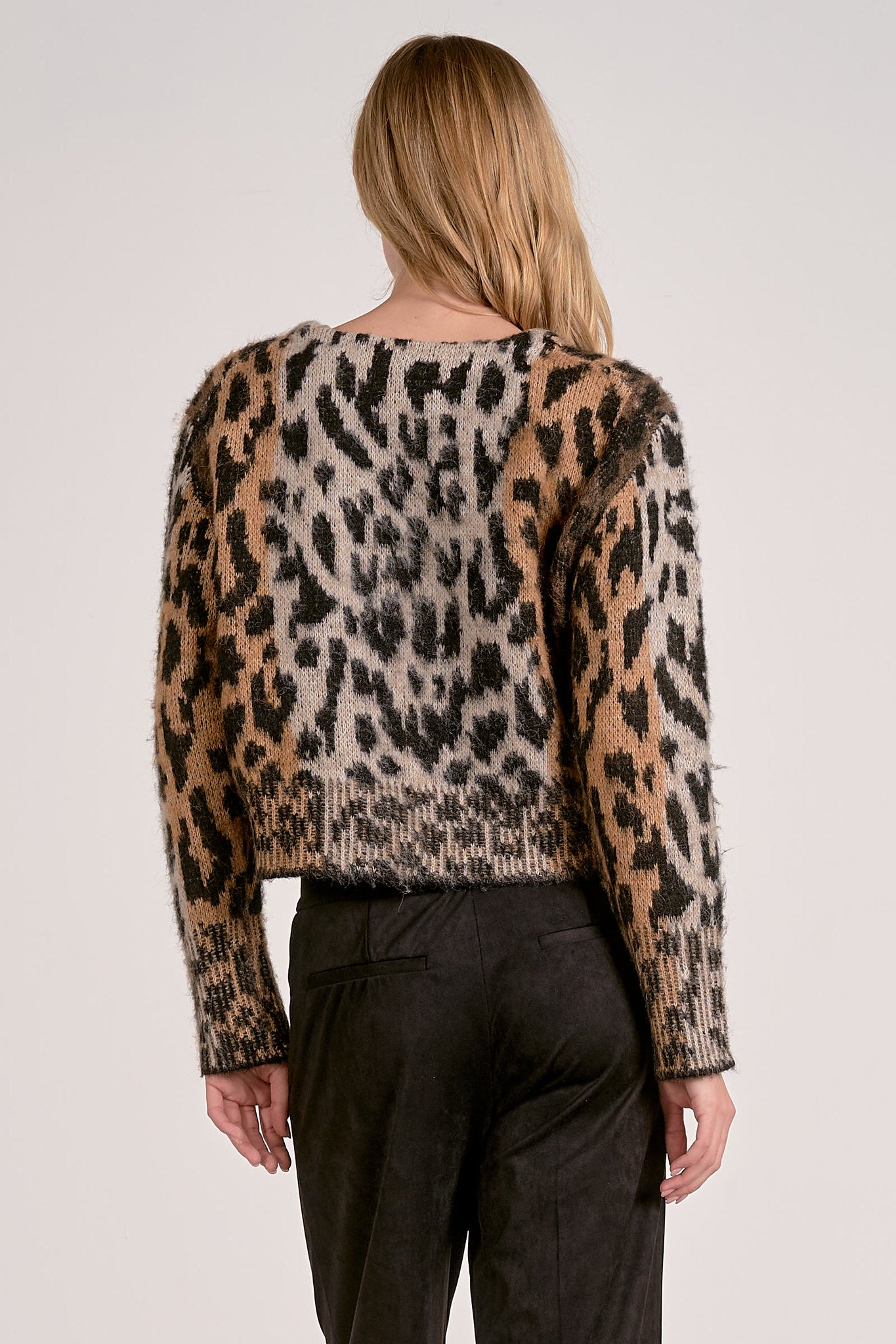 Back of the Meet & Greet Eyelash Leopard Cardigan in fuzzy eyelash knit with leopard print and button-front closure from Mainstream Boutique Bloomington