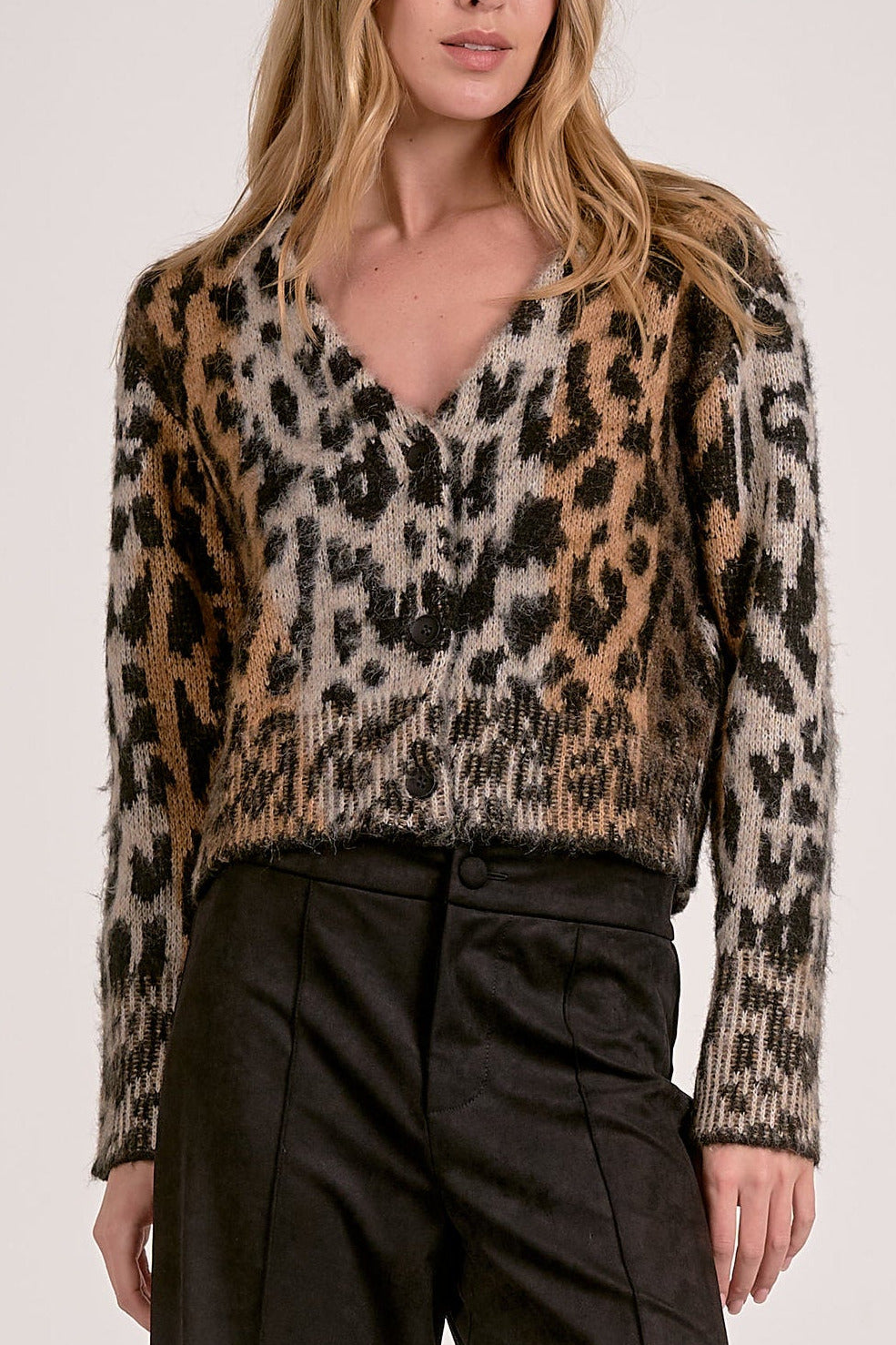 Model wearing Meet & Greet Eyelash Leopard Cardigan in fuzzy eyelash knit with leopard print and button-front closure from Mainstream Boutique Bloomington