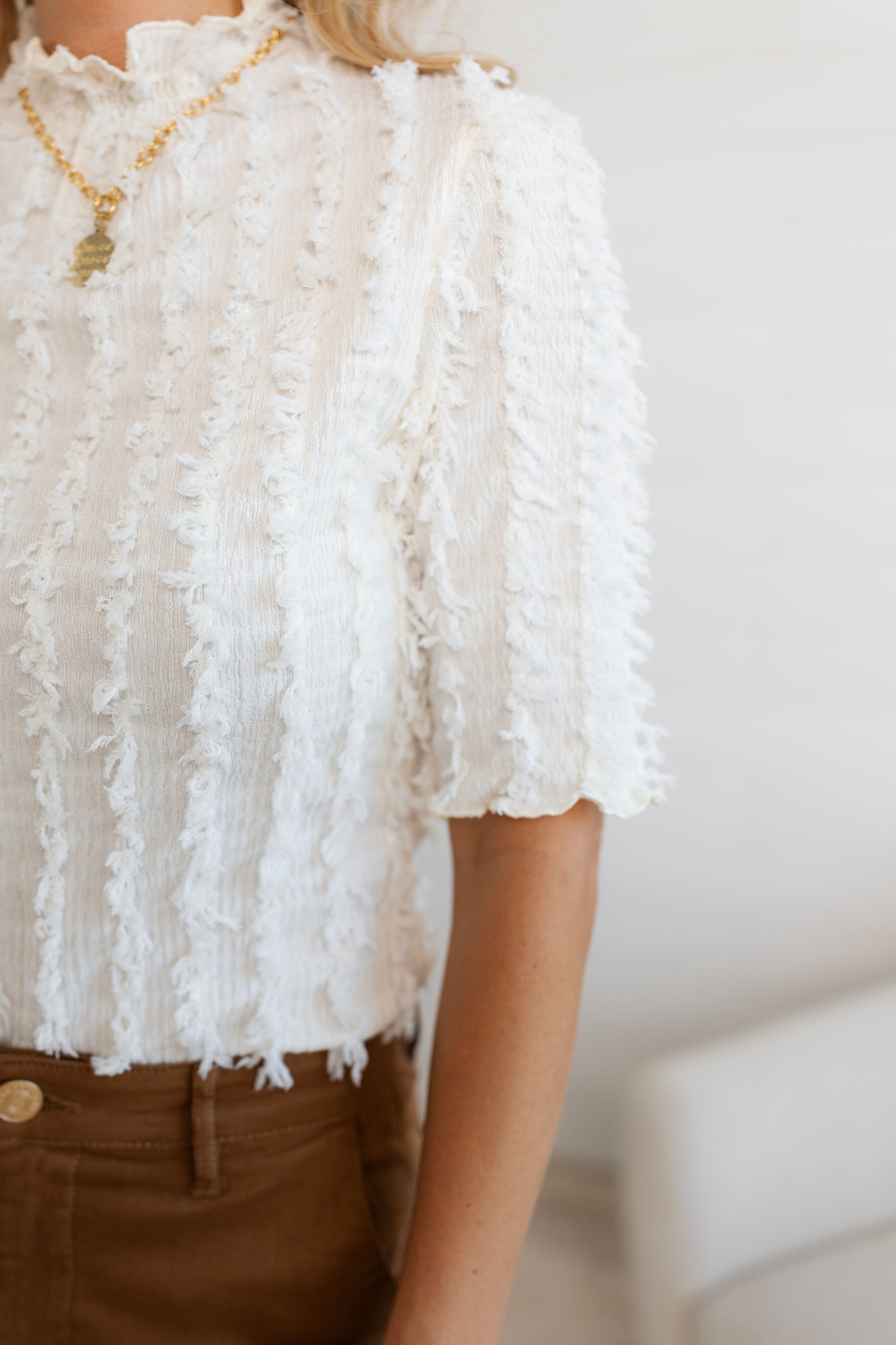 arm details on the lettuce edge detail top