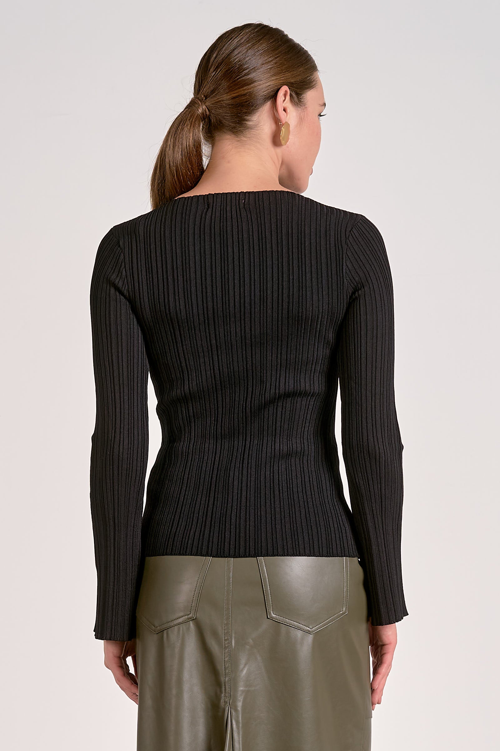 Back side of black ribbed bell sleeve long sleeve top for women