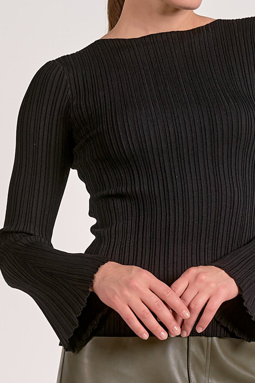 Showing details on the long sleeve crewneck bell sleeve top.