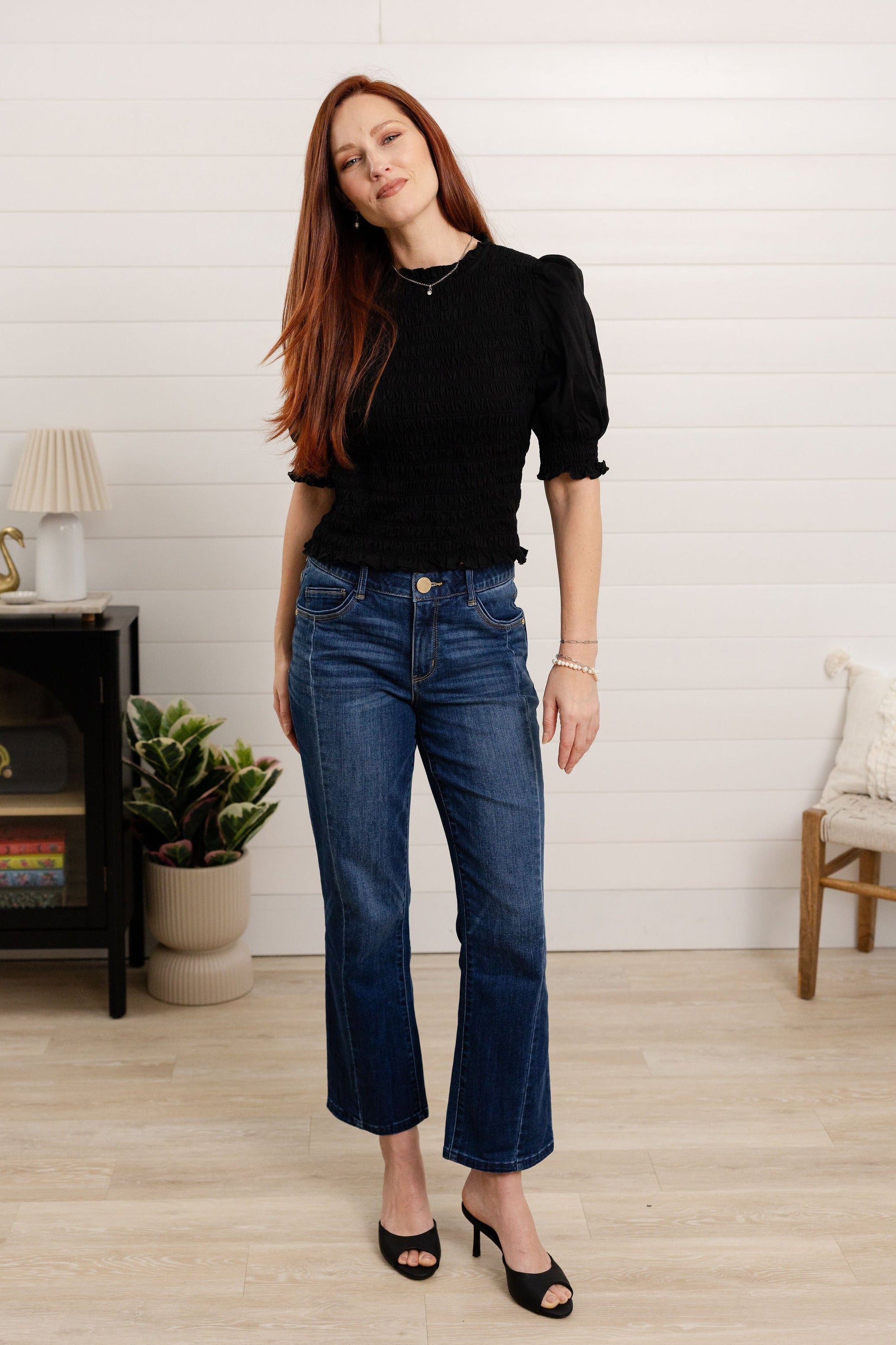 woman modeling mac and me barely boot denim in dark blue color with black top by Mac and Me