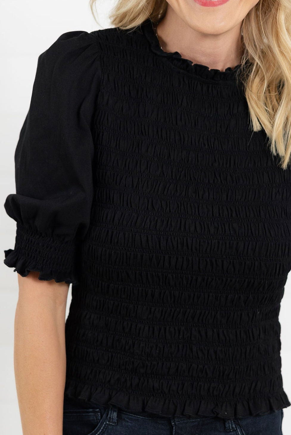 close up view of Mac and Me black 3/4 sleeve smocked top