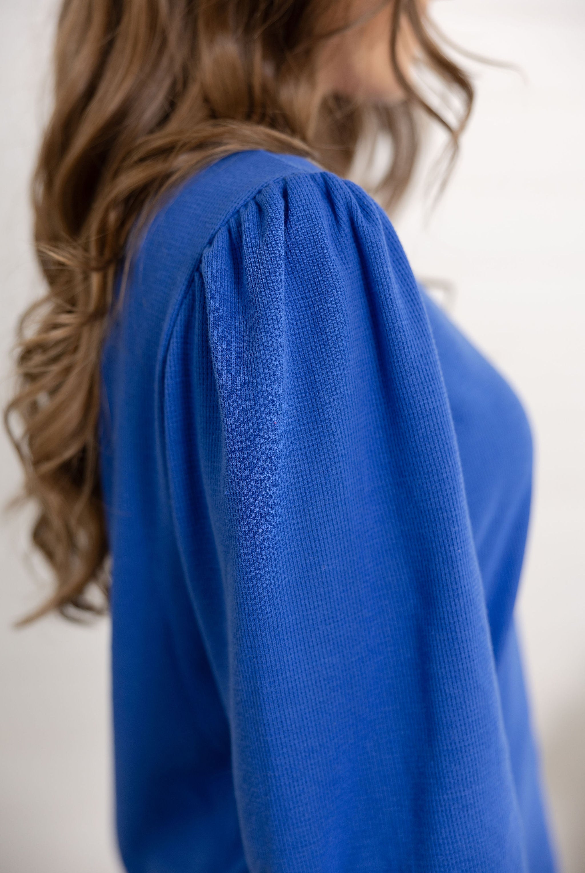 Mac showing the shoulder of the gathered shoulder detail top