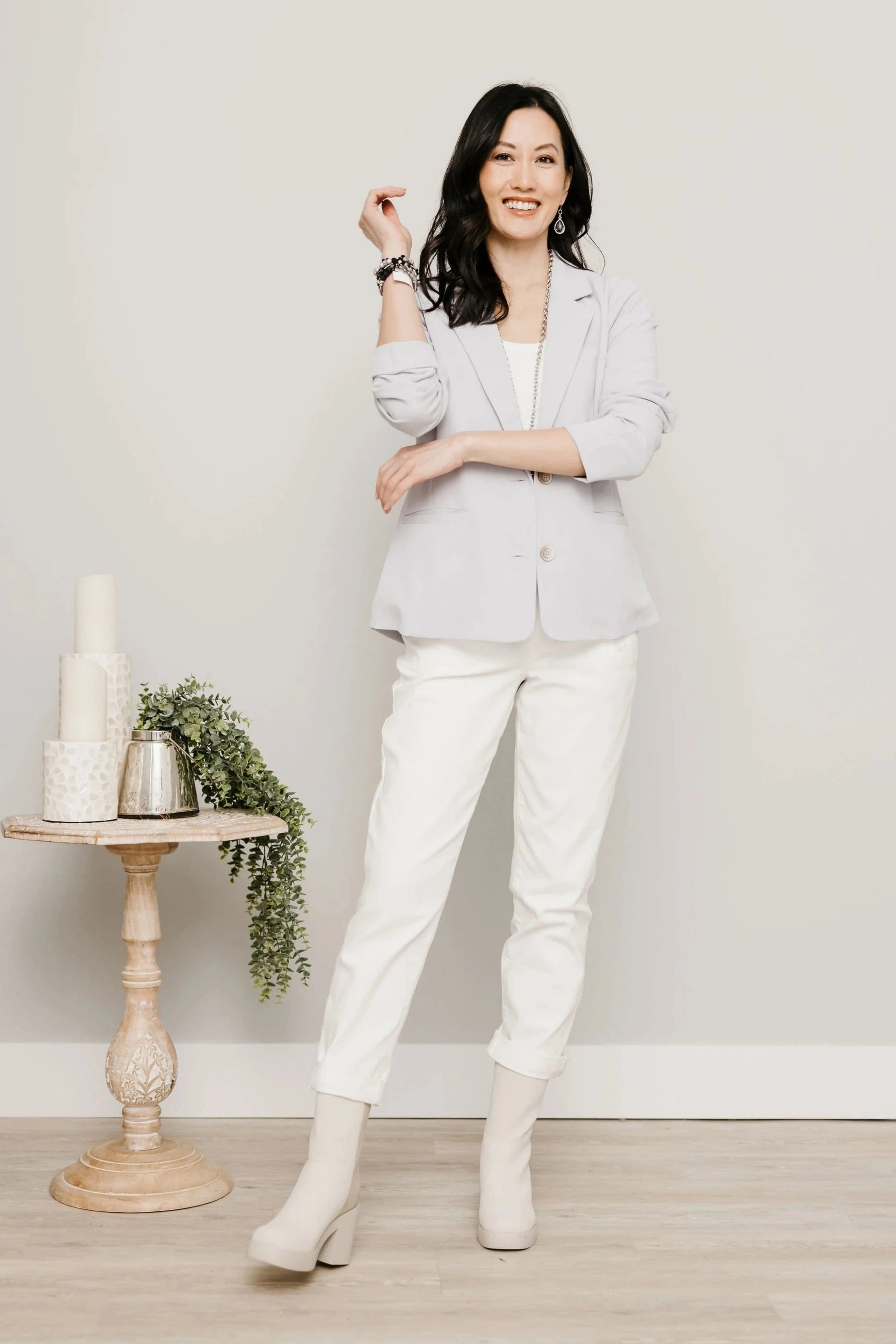 Mac and Me white jeans styled with jacket and boots for transitional dressing