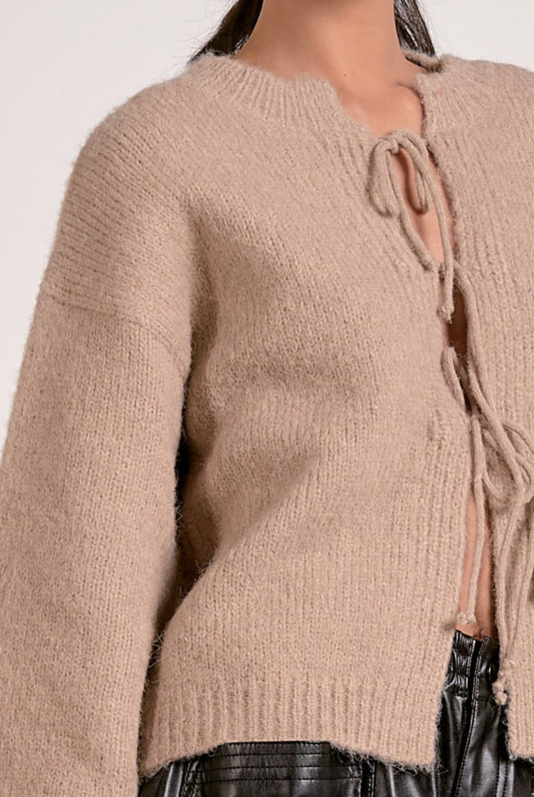 Showing details on the macchiato tie front sweater.