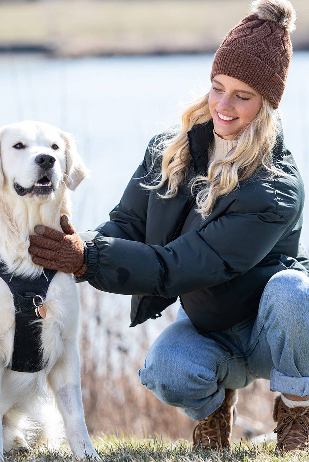lifestyle shot of a girl in knit tech touchscreen gloves with cozy cuff detail in a brown color.