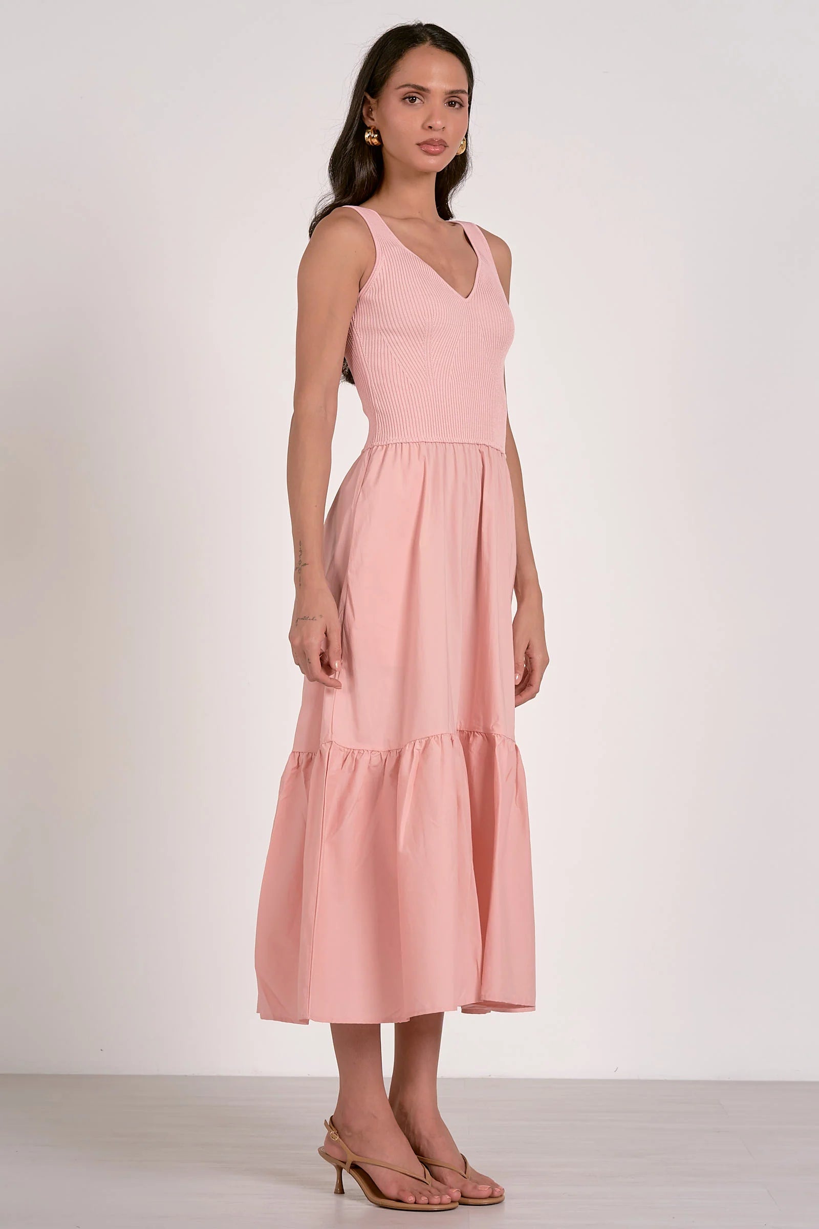 side view of blush ribbed knit mixed media midi dress with tiered skirt and pockets