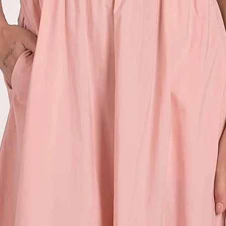 close up view of color and fabric on bottom of blush ribbed knit mixed media midi dress with tiered skirt and pockets