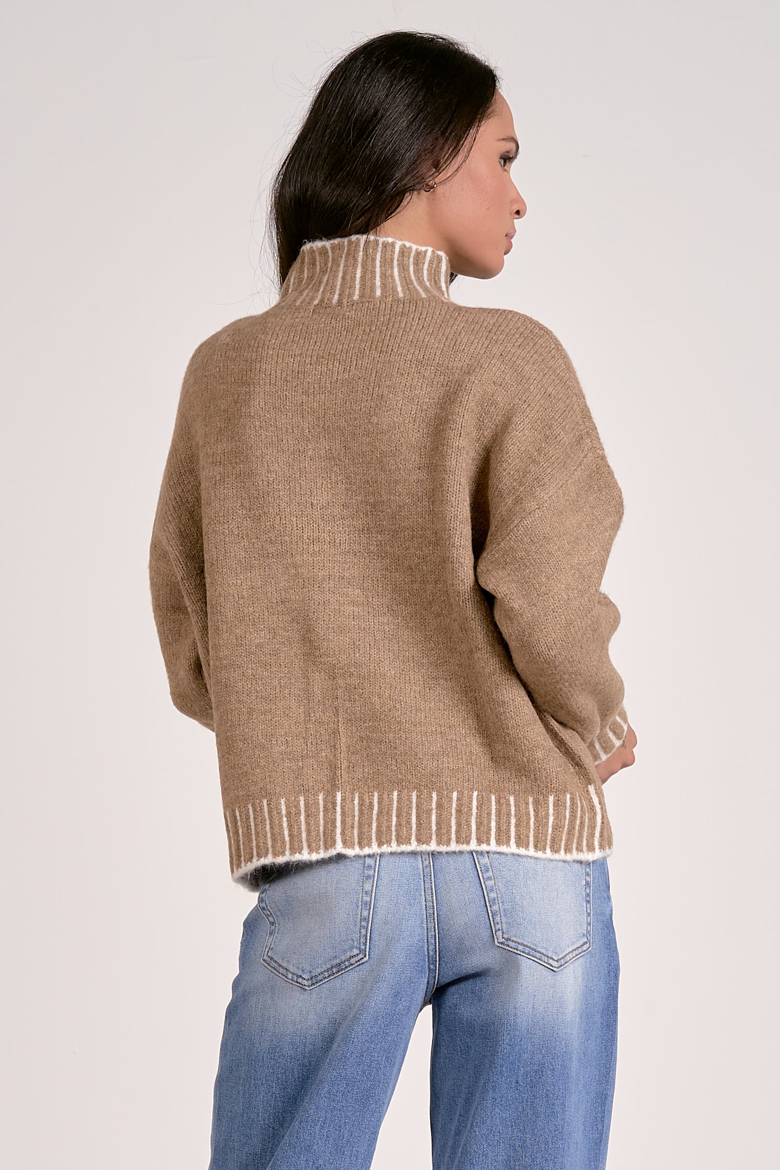 tan mock neck sweater with white whipstitch back view