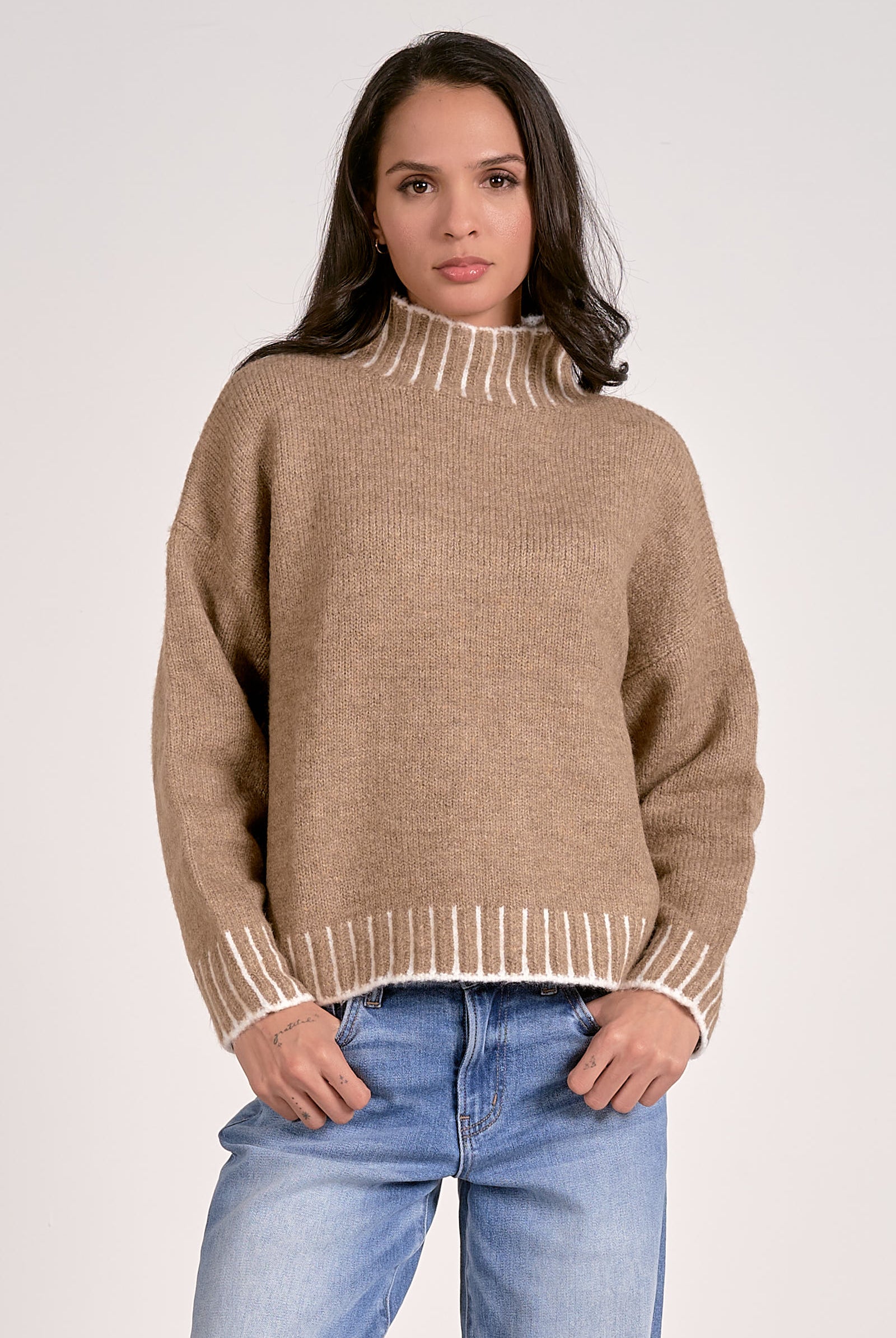 tan mock neck sweater with white whipstitch front view