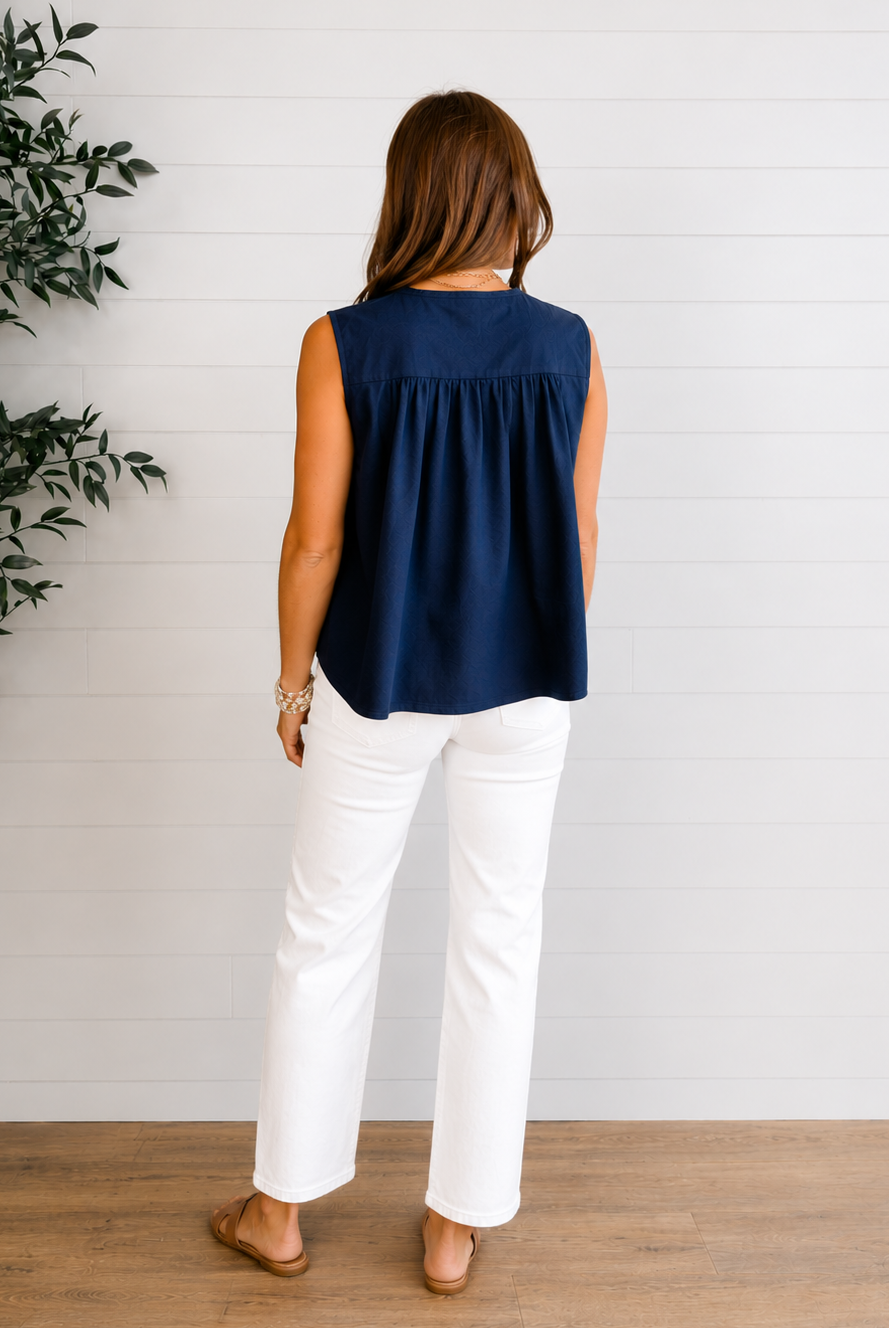 model showing back of sleeveless navy tie front top