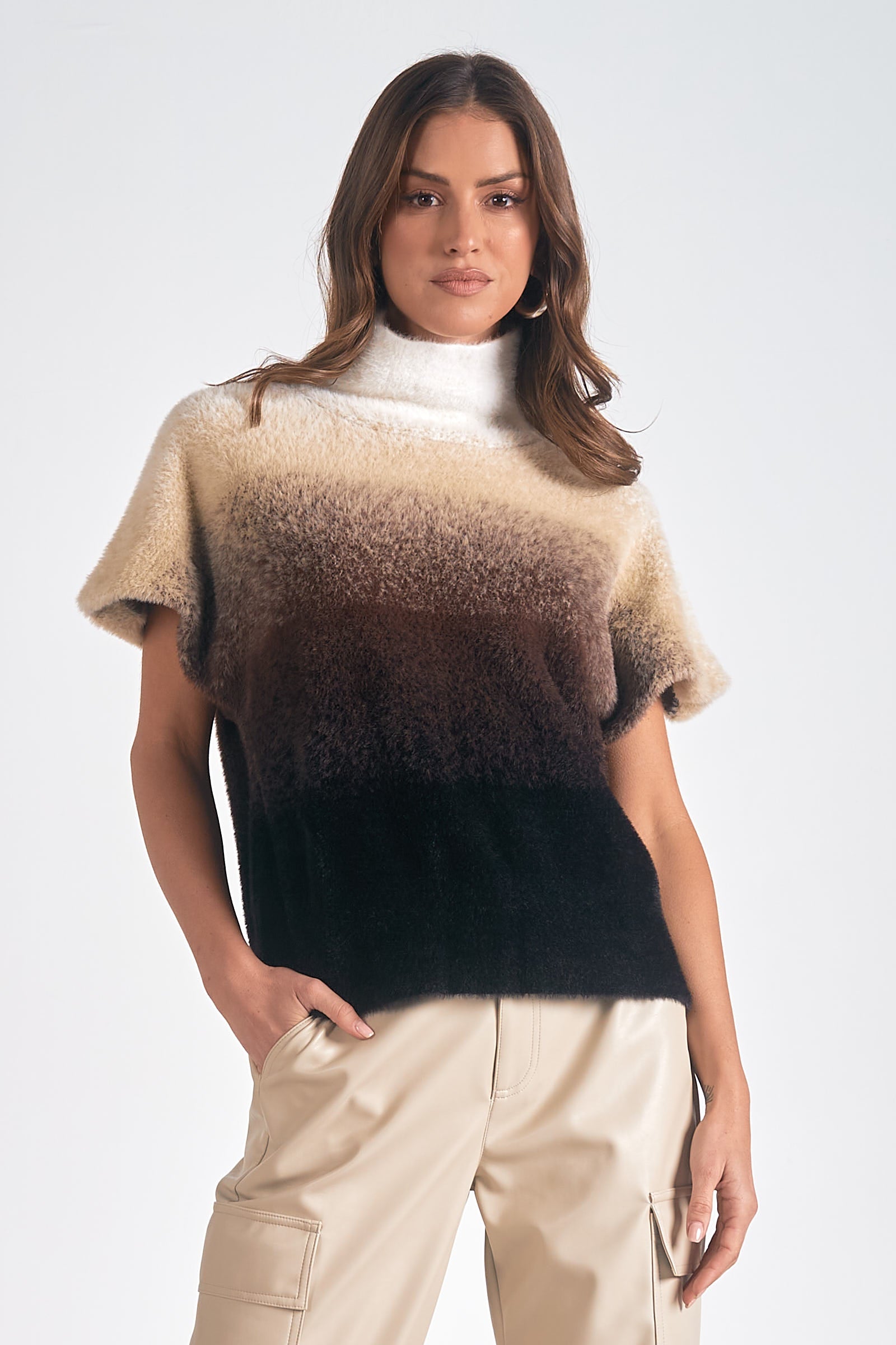Model in Horizon Ombre Dolman Sweater in cream to black gradient knit with mock neck from Mainstream Boutique Bloomington