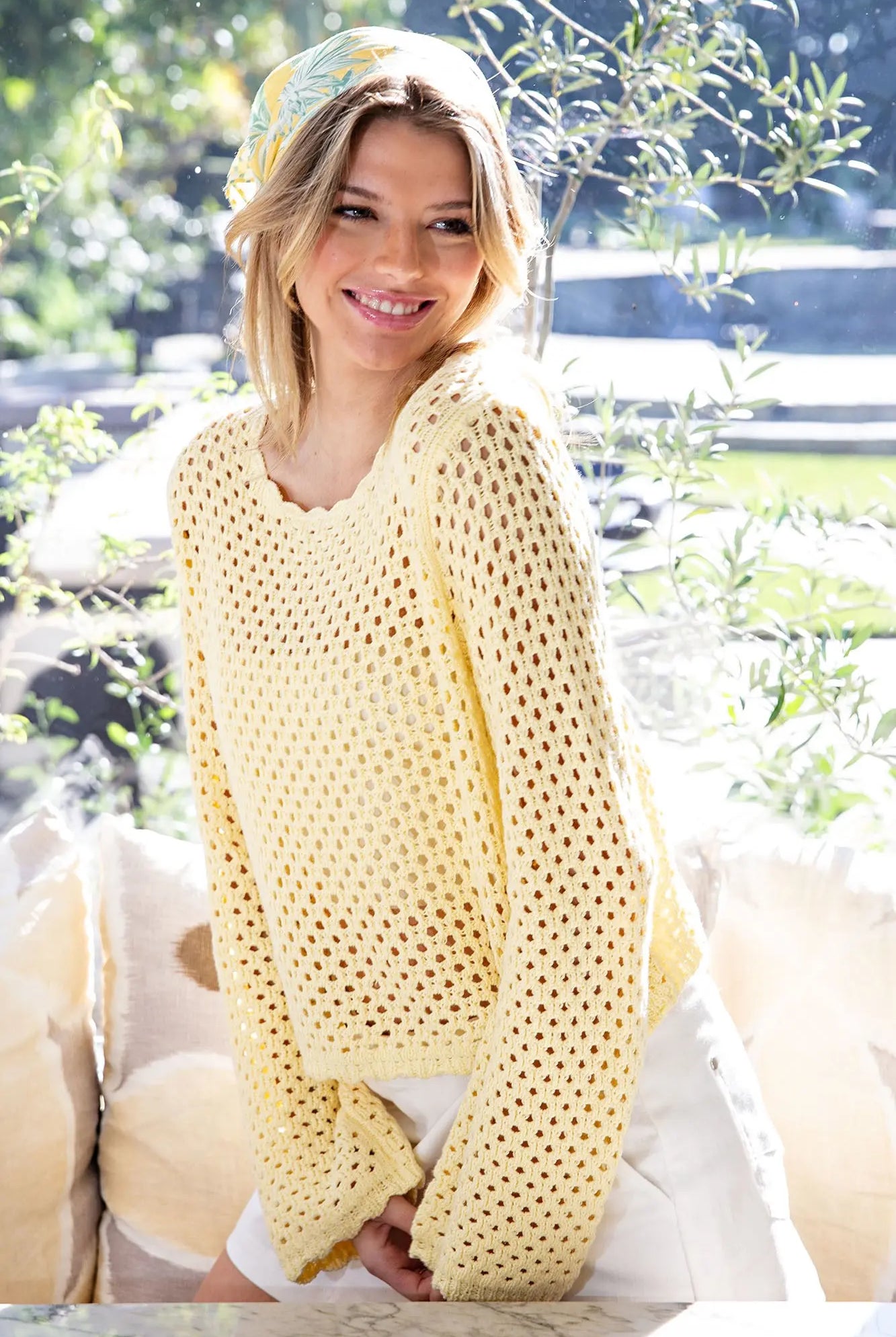 Lightweight scallop trim sweater styled with white shorts