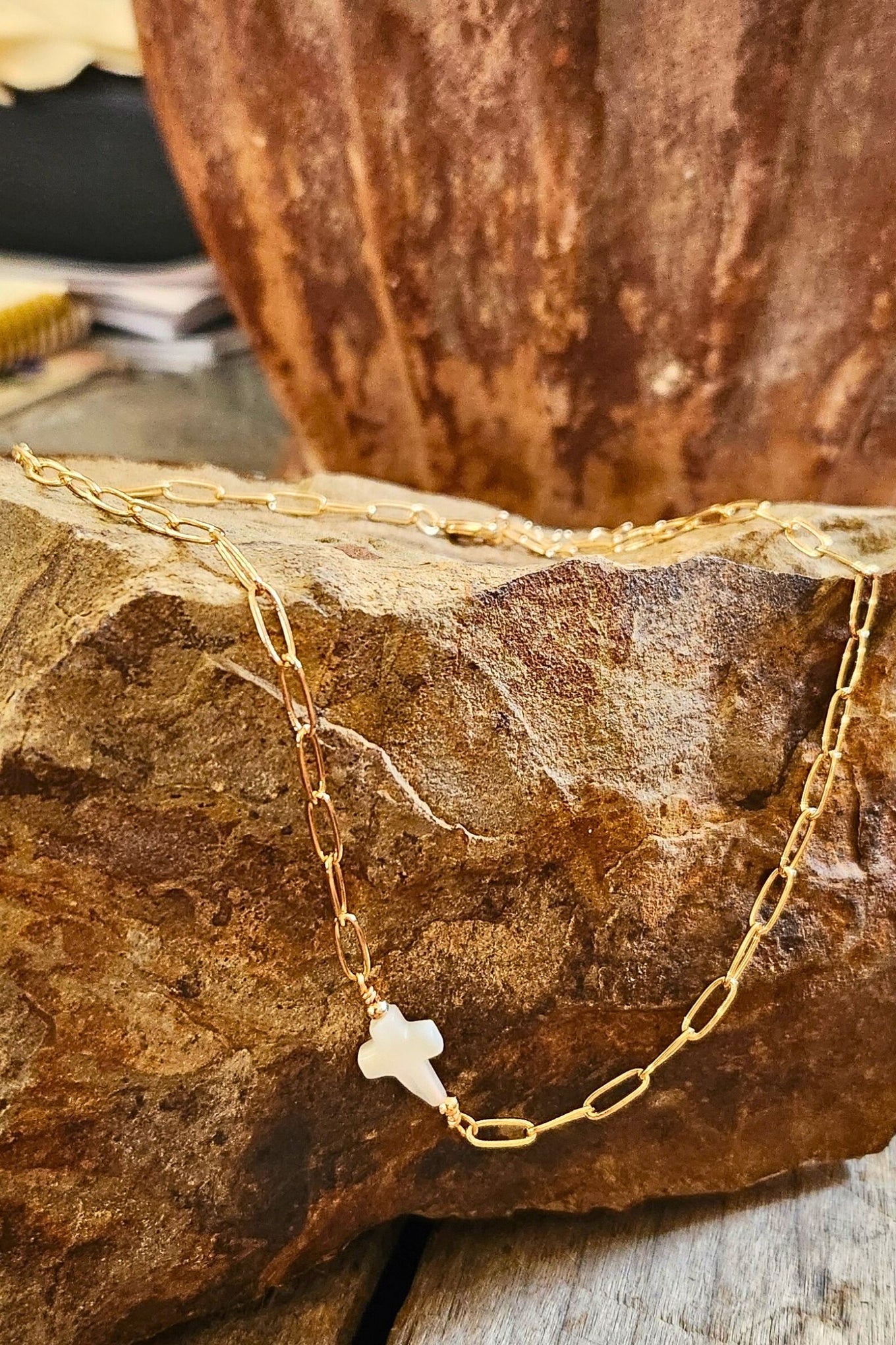 Gold chain necklace with sideways pearl cross pendant, delicate and perfect for layering