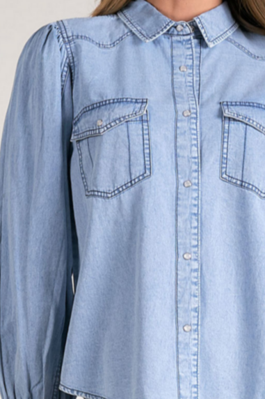Showing the button details on the puff sleeve denim button down top