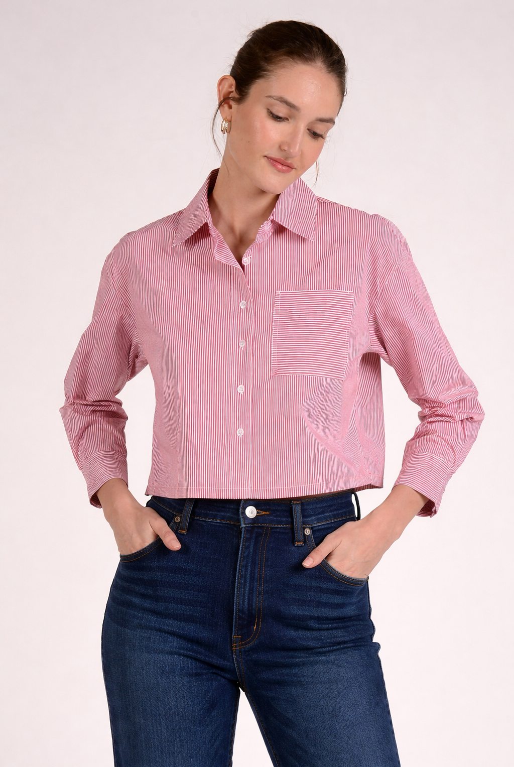 Red stripe button front top with collared neckline, button front closure, and front pocket detail paired with dark denim