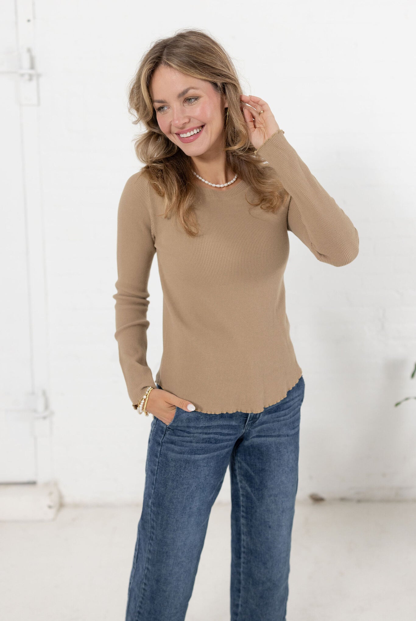 woman modeling the mac and me ribbed waffle top in tan with mac and me jeans