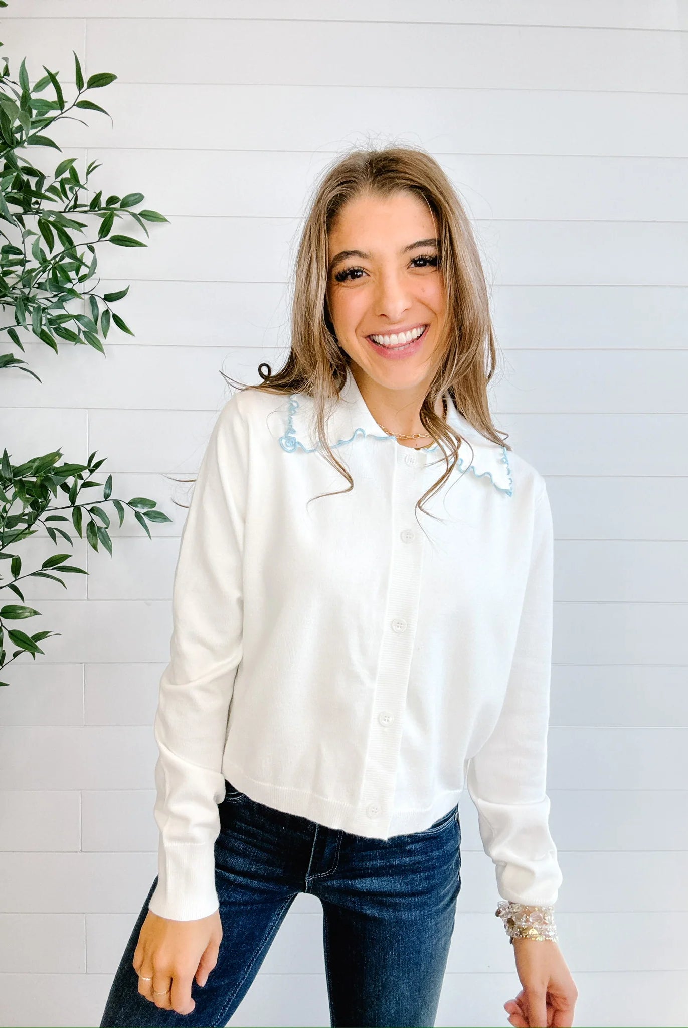 Mac and Me ivory ruffle collar sweater with blue lettuce trim worn with dark denim