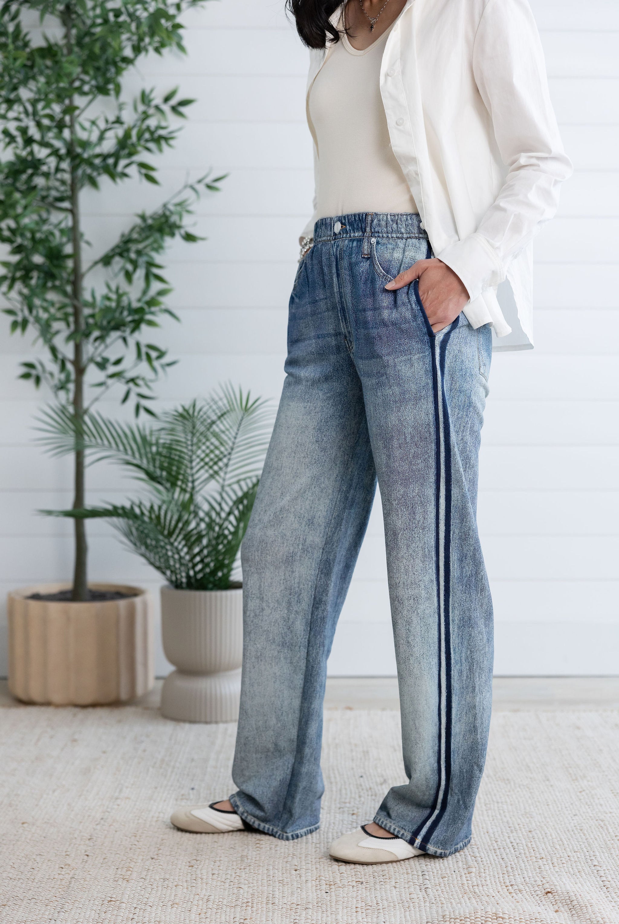 woman modeling side and front of lounge pant, the light blue Side Stripe Relaxed Denim Pant