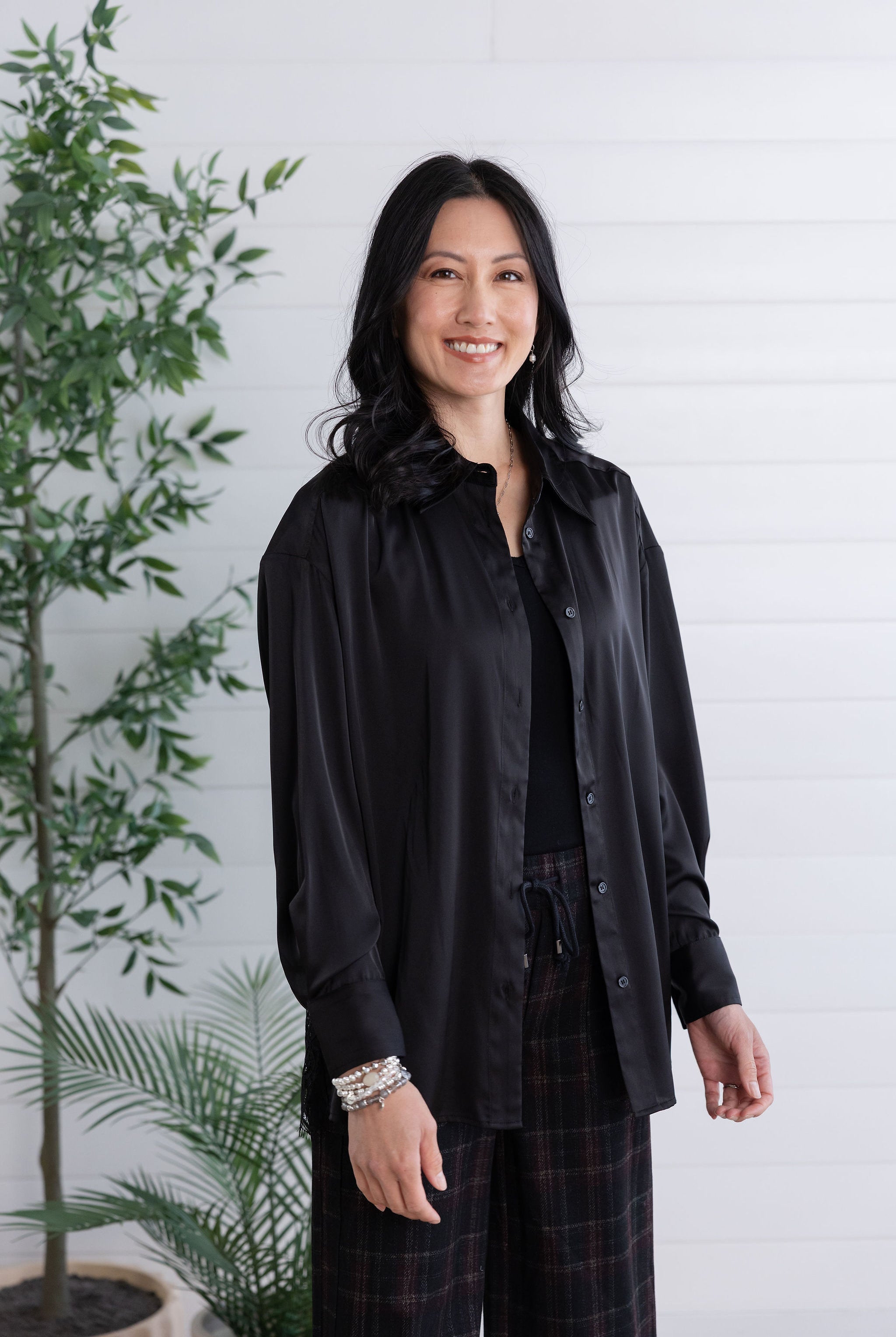 front view and unbuttoned black lace-back button down